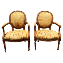 French 19th Century Louis XVI Walnut Arm Chairs - Set of 2