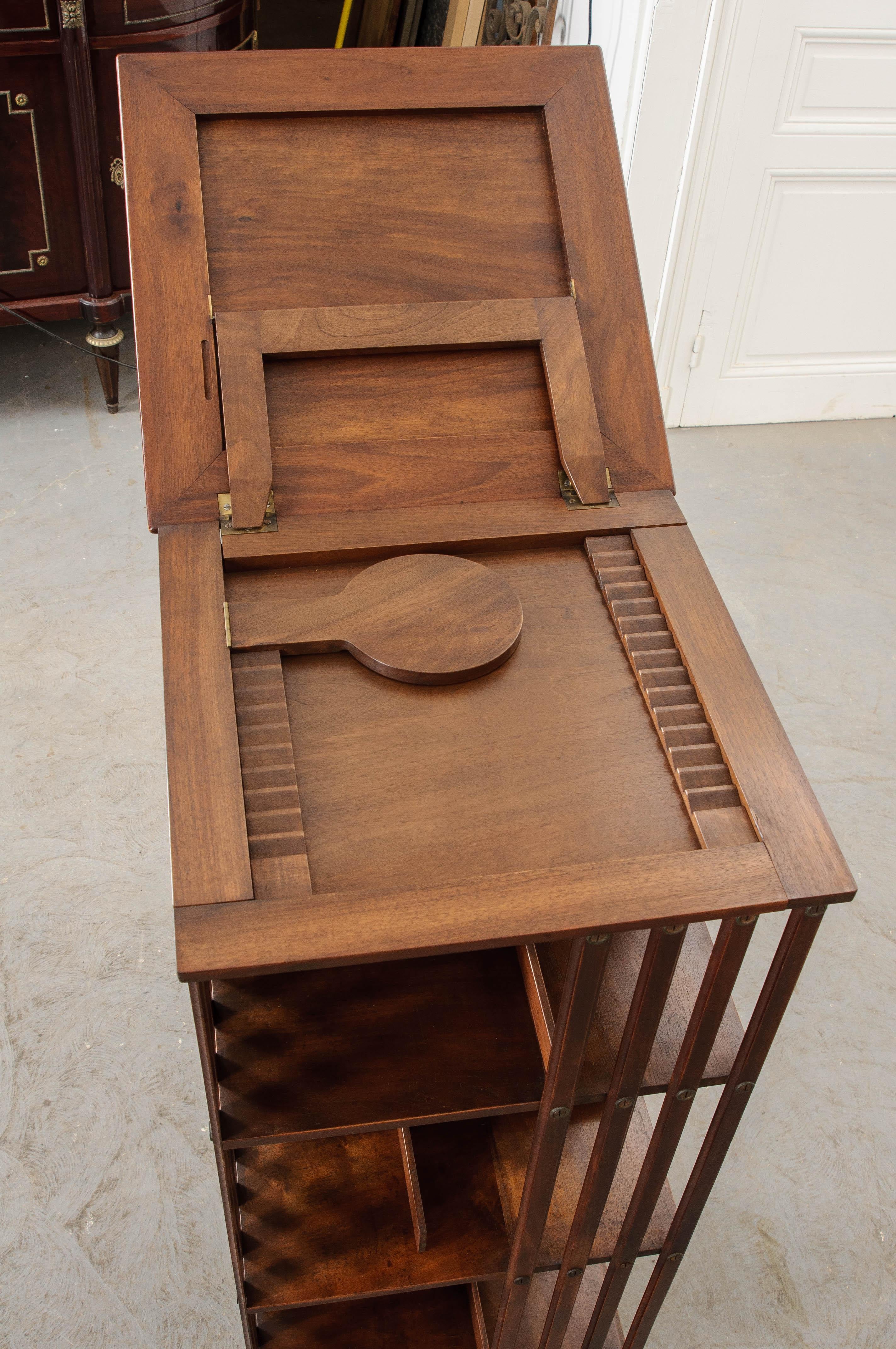 A fantastic and fun mahogany revolving bookcase, made in France circa 1870. The antique bookcase was made using solid mahogany. Thinly ripped mahogany vertical slats give the antique a look that was ahead of its time. Its incredible lines could have