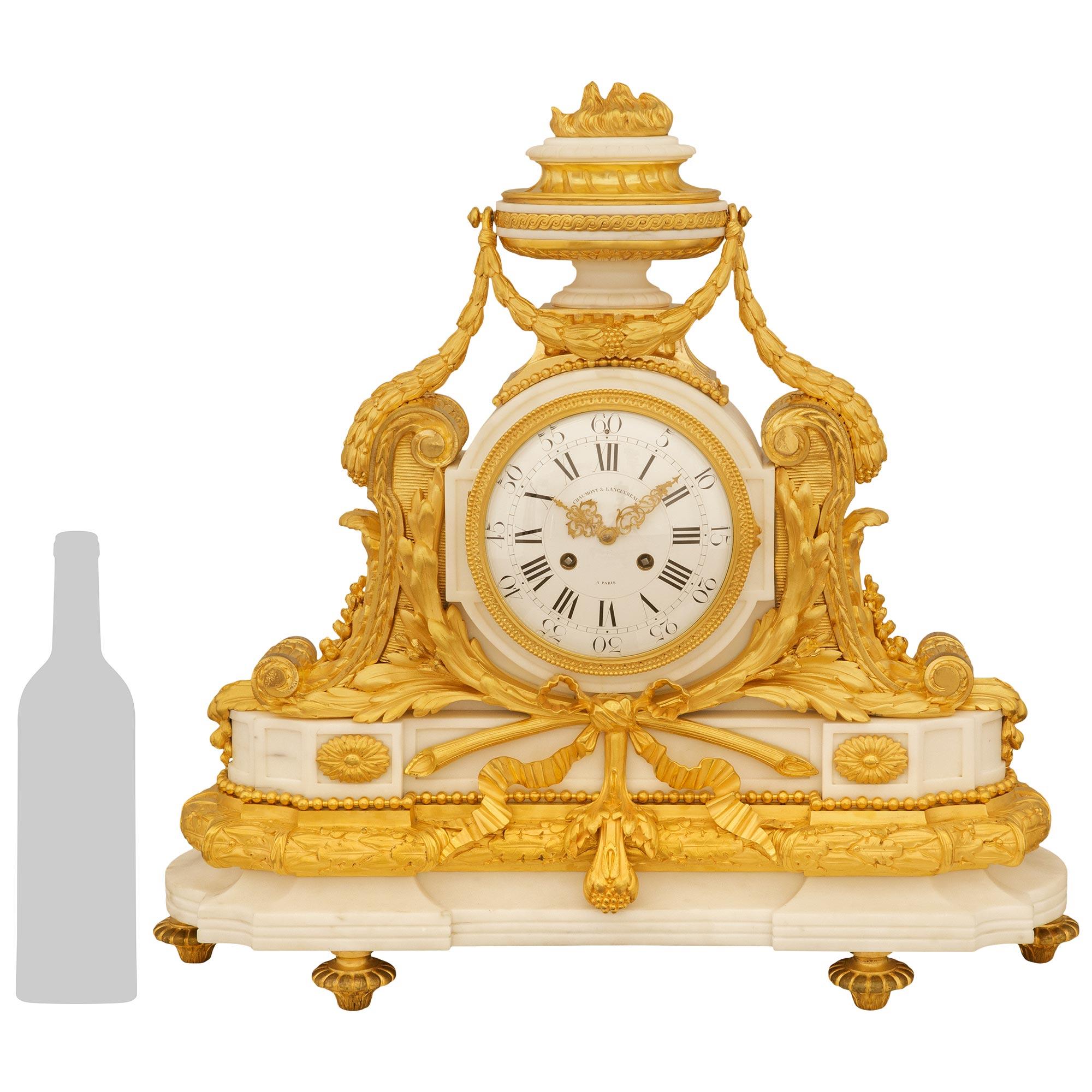 A stunning and most impressive French 19th century Louis XVI st. Marble and Ormolu clock, by Chaumont & Languereau. This large scale clock is raised by six Ormolu toupie shaped feet with gadrooned edges supporting an intricately carved statuary