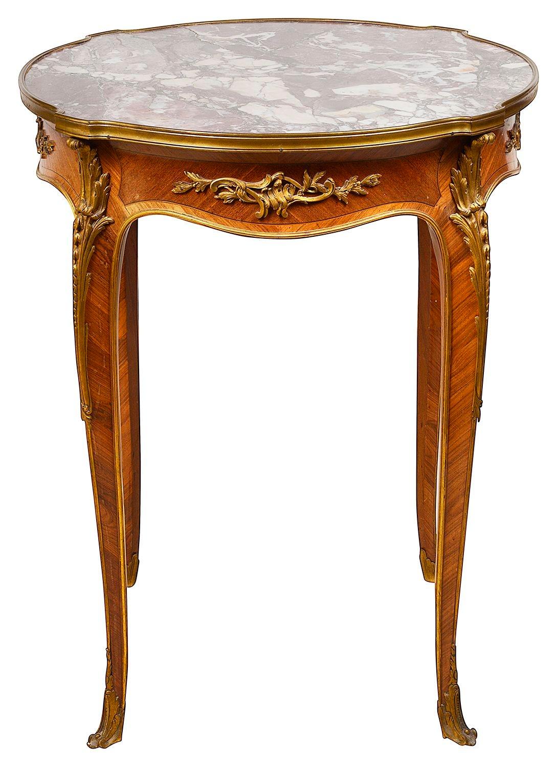 A fine quality late 19th century French rouge marble topped, Geridon, attributed to Francoise Linke.
Having wonderful gilded ormolu scrolling foliate mounts and moulding, an inset rouge marble top and raised on elegant cabriole legs, terminating in
