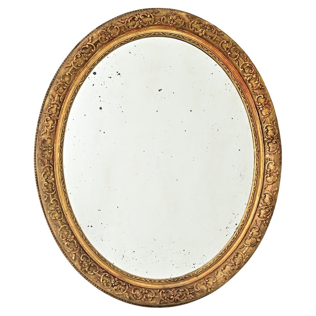 French 19th Century Massive Oval Gilt Mirror For Sale