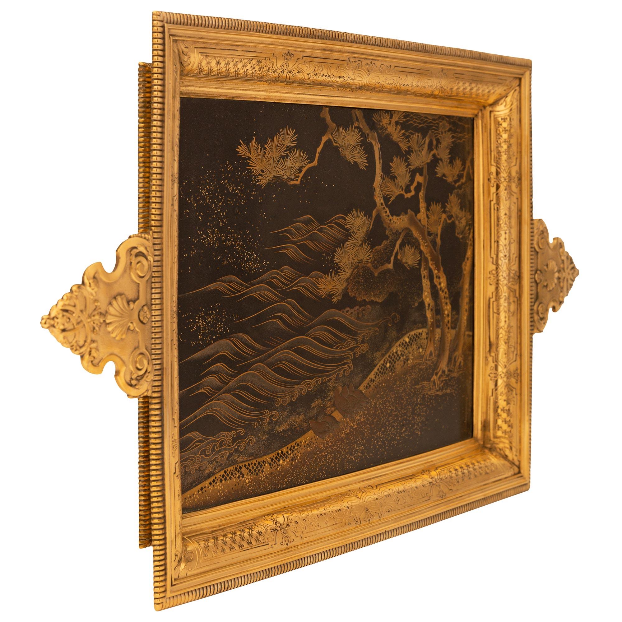 A very unique and highly detailed French 19th century Meiji period Japanese Lacquer and Ormolu Tray, stamped Bointaburet A Paris. This exquisite rectangular tray was fashioned with Japanese Lacquer and contains a central image of an elevated
