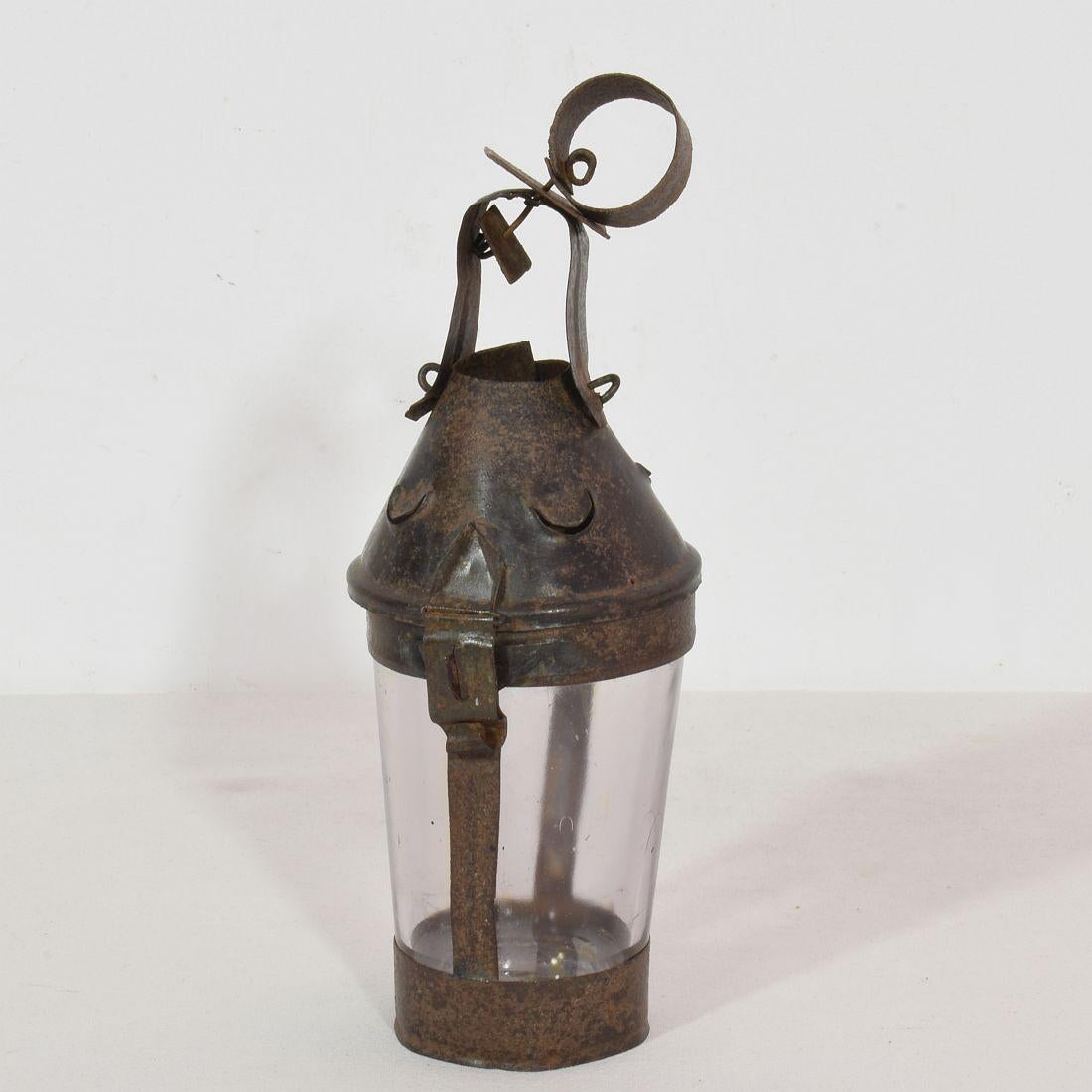 Very rare small folk art lantern, France, circa 1850-1900.
Made from a part of a glass Evian water bottle and iron.
Beautiful weathered.