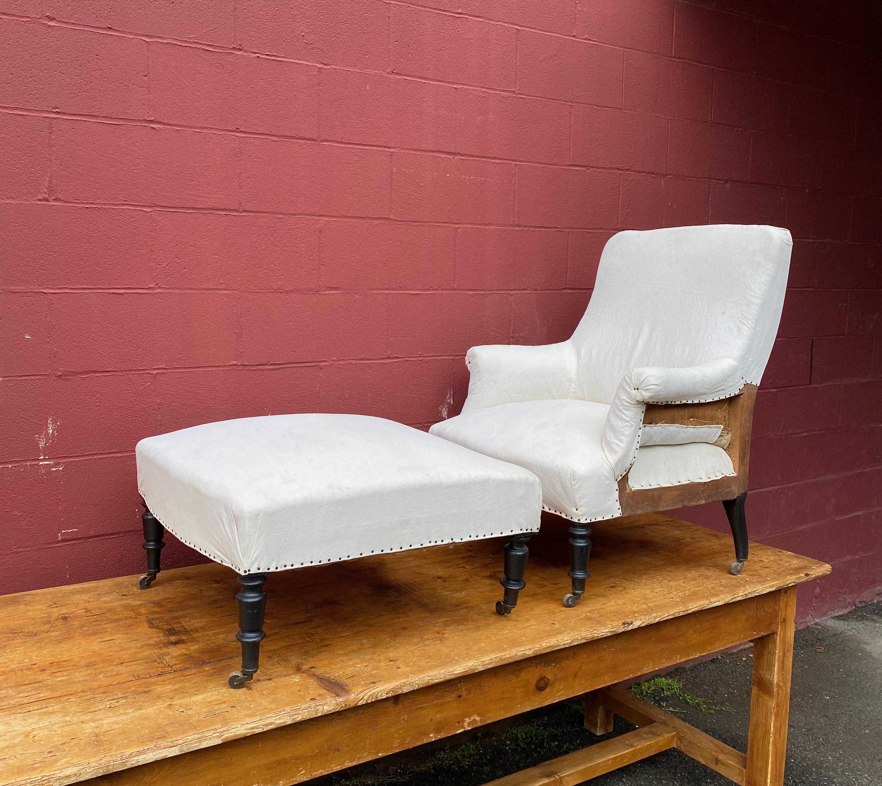 An armchair and matching ottoman in the French Napoleon III style, referred to in French as a “duchesse brisée”. Both pieces have been stripped down to the muslin and are ready to be upholstered.

Dimensions: 30” D x 31” W x 36” H (seat height