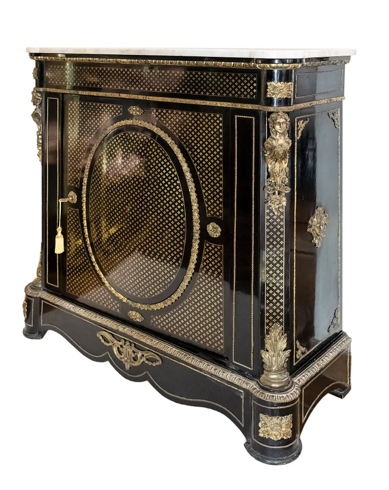 French antique Napoleon III cabinet.
Wood is decorated with inlaid brass and bronze details ourside.
Inside the cabinet there are two shelves.
Cabinet top is marble.
This cabinet is in very good antique condition.