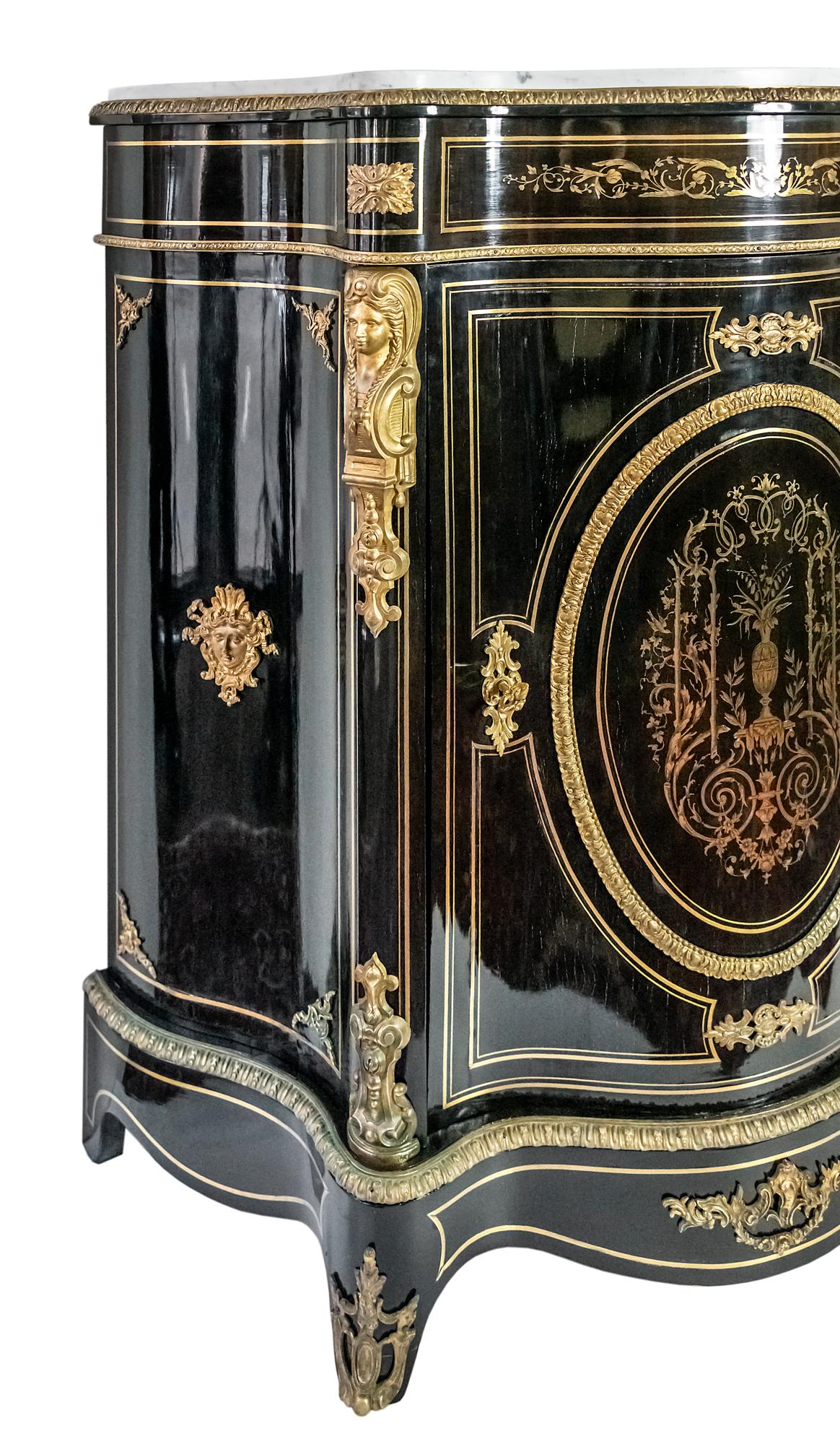 French antique Napoleon III cabinet.
Wood is black color polished surface, decorated with inlaid brass decor and bronze details outside.
Inside the cabinet there are two shelves.
Cabinet top is marble.
Very good antique condition.