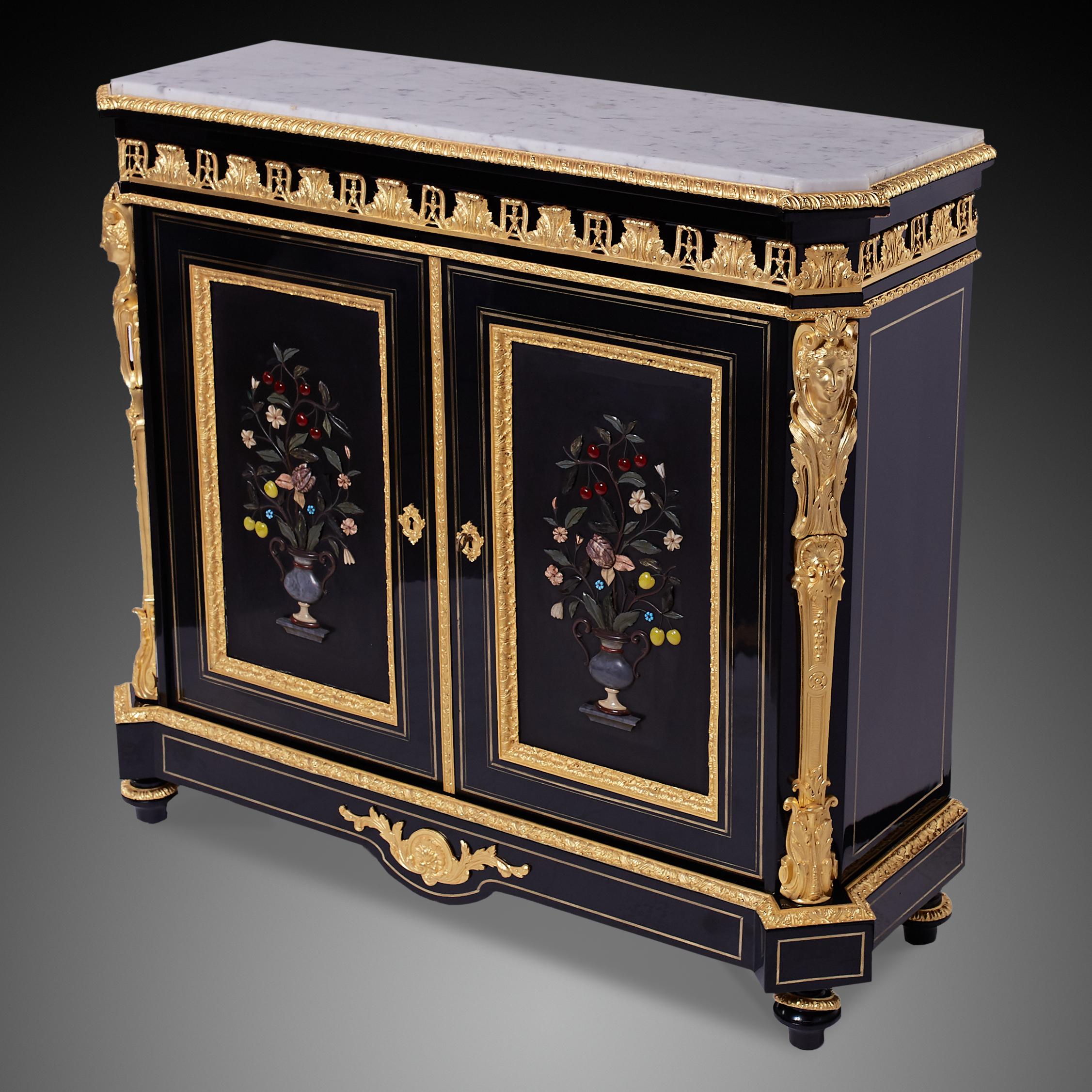 French bronze-mounted Ebonized and Pietra Dura cabinet
Empire style ormolu and Pietra dura cabinet from 19th c.

Napoleon III ormolu veneered ebony cabinet in Second Empire style by . In the 19th century, the Empire style prevailed in the years