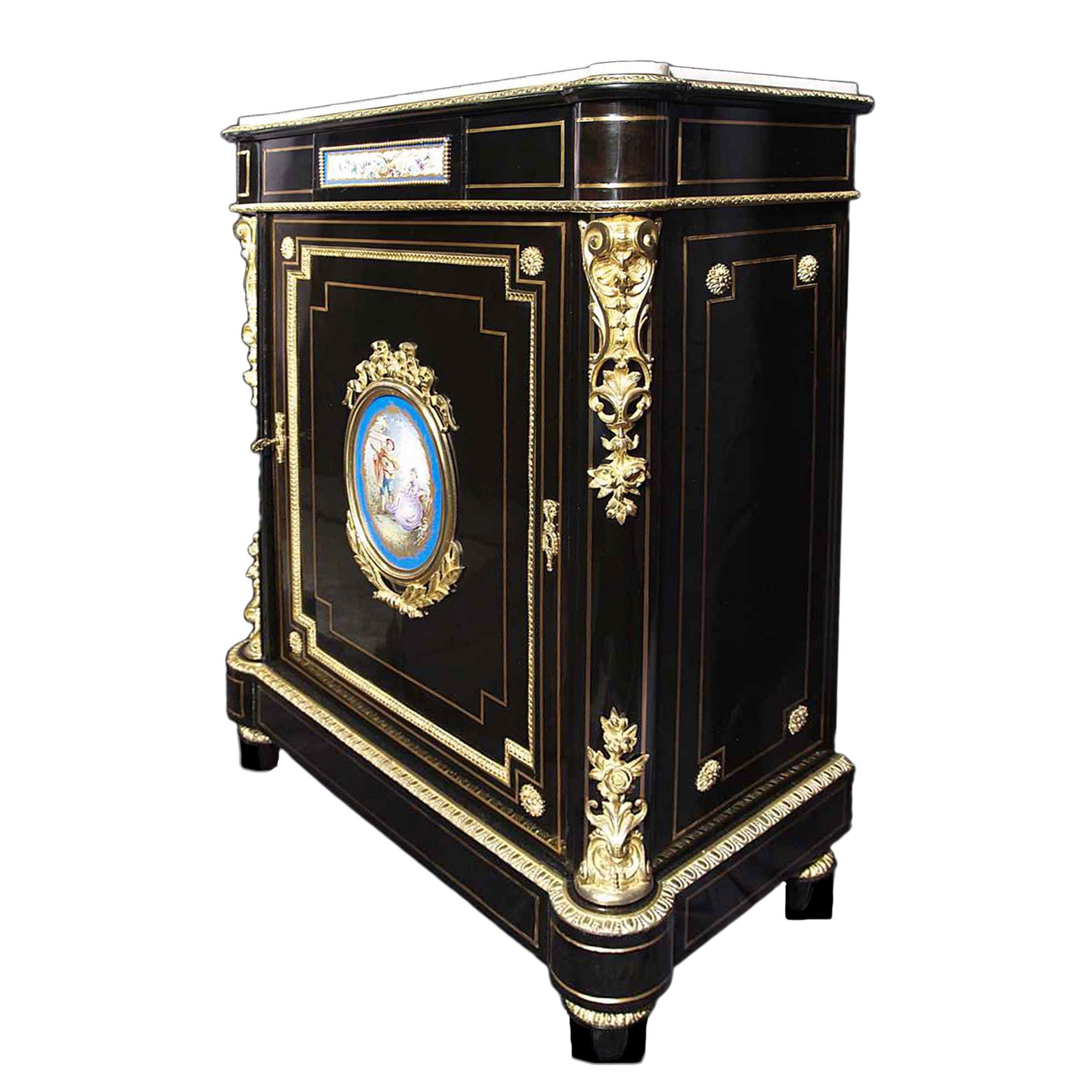 An attractive and very elegant French 19th Century Napoleon III period ebony cabinet with Sèvres porcelain plaques and ormolu mounts. The one door cabinet is raised by topie supports below the straight apron and rounded corneres with brass filets.