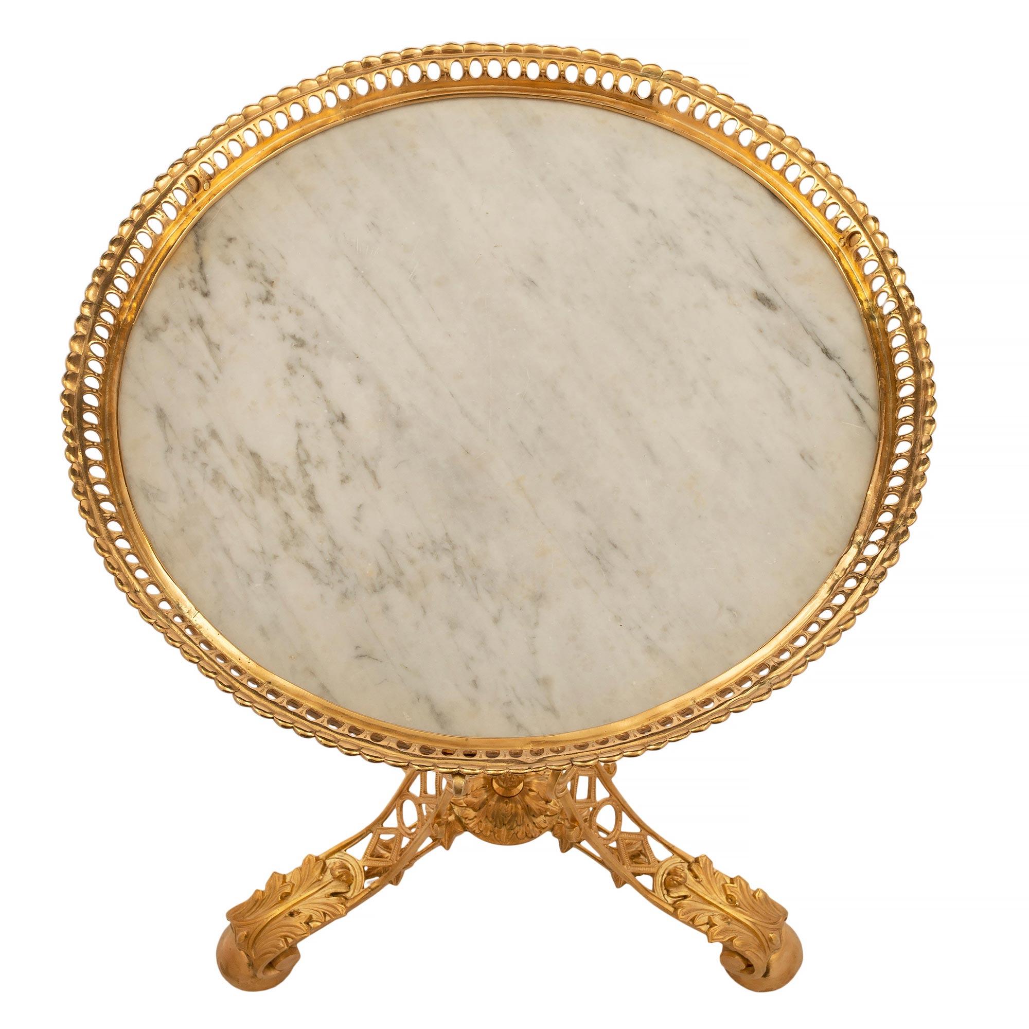 A striking French 19th century Napoleon III Period ormolu and marble side table. The table is raised by lovely half ball feet below large acanthus leaves and three beautiful lightly scrolled pierced legs. Each leg is connected by a fine stretcher