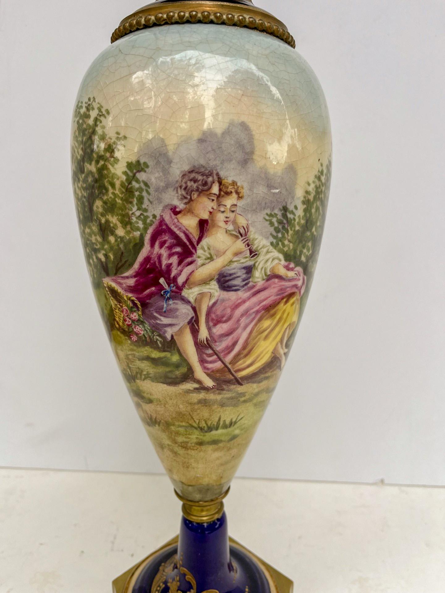 French 19th Century Napoleon III Sevres Style Porcelain Vase

Beautiful lidded Sevres style vase with ormolu mounts in the manner of the famous French porcelain manufactory. Elegant and slender baluster form. The domed lid has a pineapple finial.
