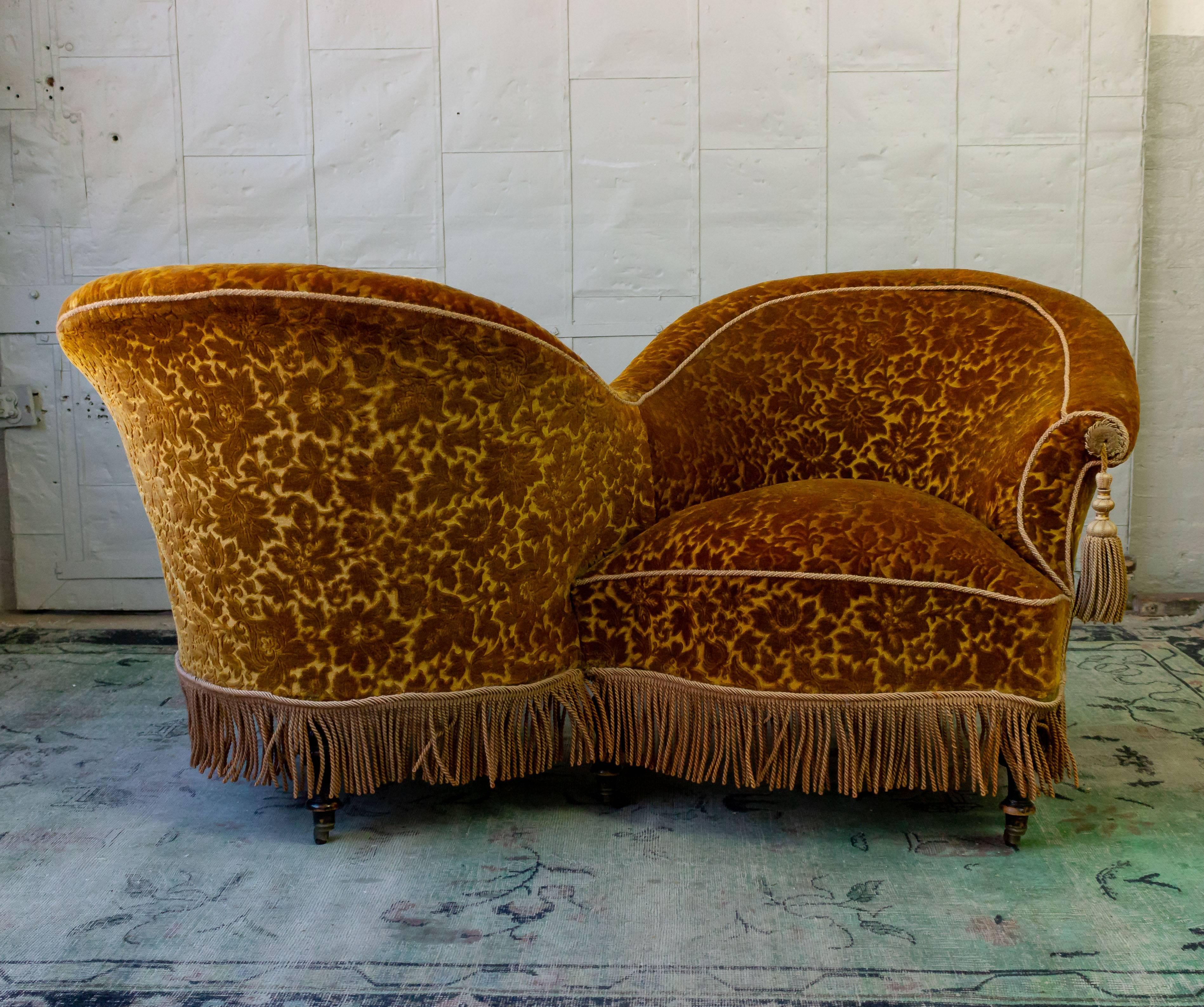 Unusual French armchair (s) called tête-à-tête in French, or a Conversation chair, 19th century Napoleon III period. In very good condition, upholstery most likely 1930s.