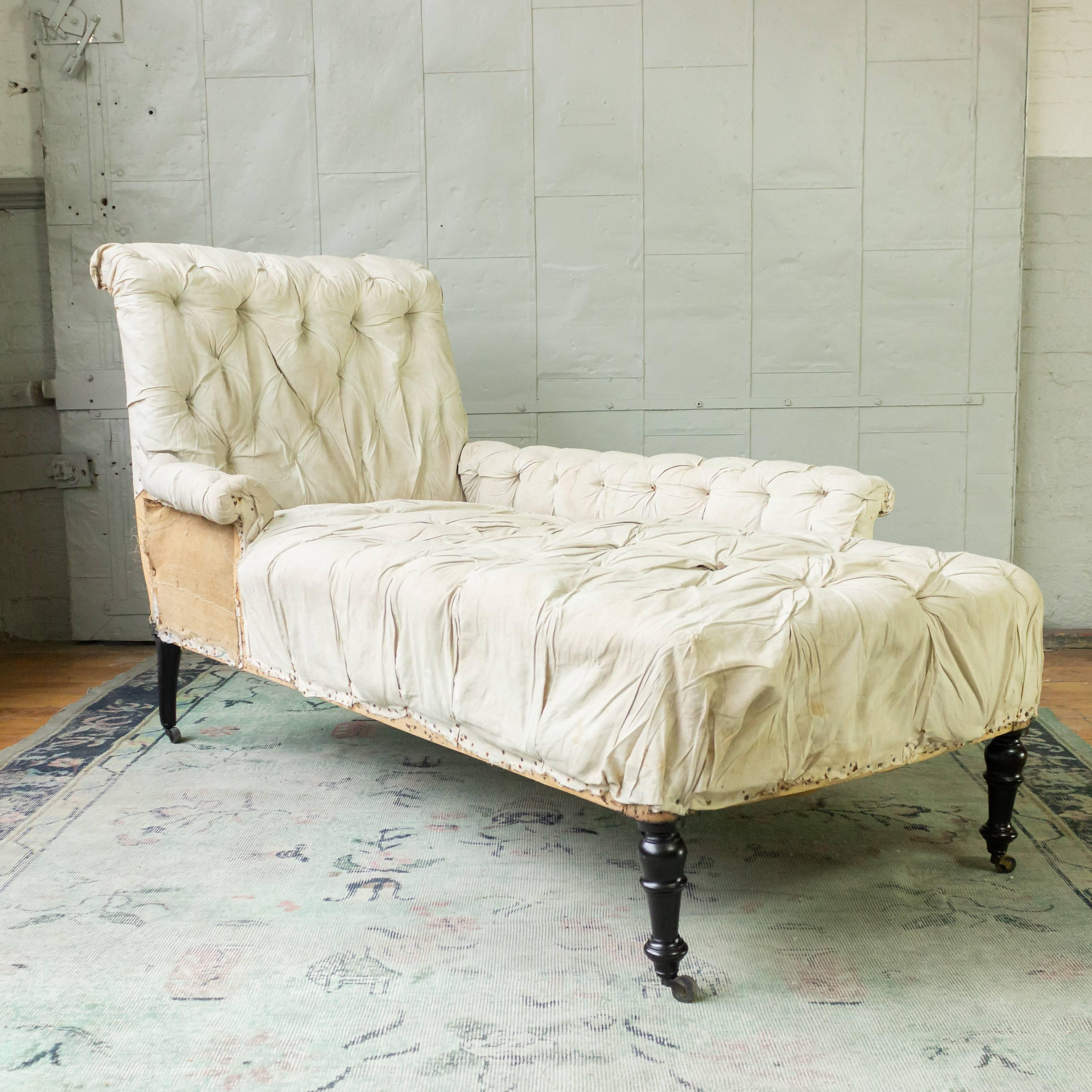 French 19th century Napoleon III tufted chaise longue with a left sided extended arm. The chaise lounge has been stripped down the muslin and is ready for to be upholstered.  


Sold as is