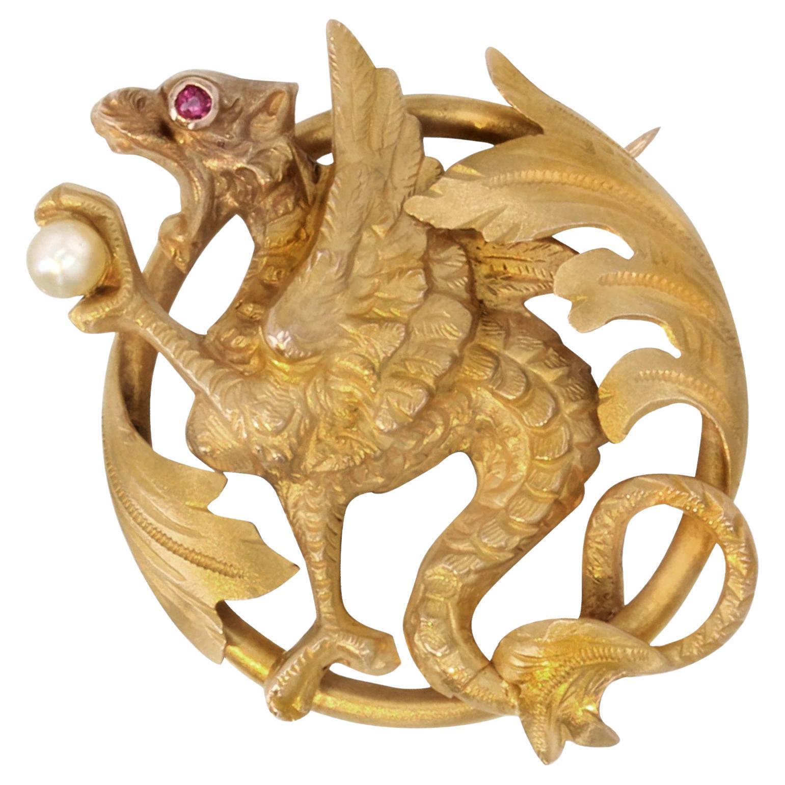 French 19th Century Natural Pearl Ruby 18 Karat Yellow Gold Chimera Brooch For Sale