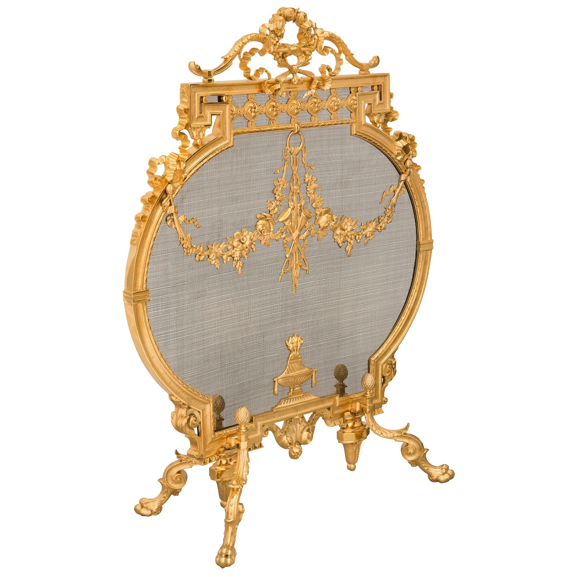 A striking and very high quality French 19th century Neo-Classical st. Belle Époque period ormolu fire screen. The screen is raised by elegant scrolled legs with handsome paw feet and adorned with charming acanthus leaves leading to fine acorn