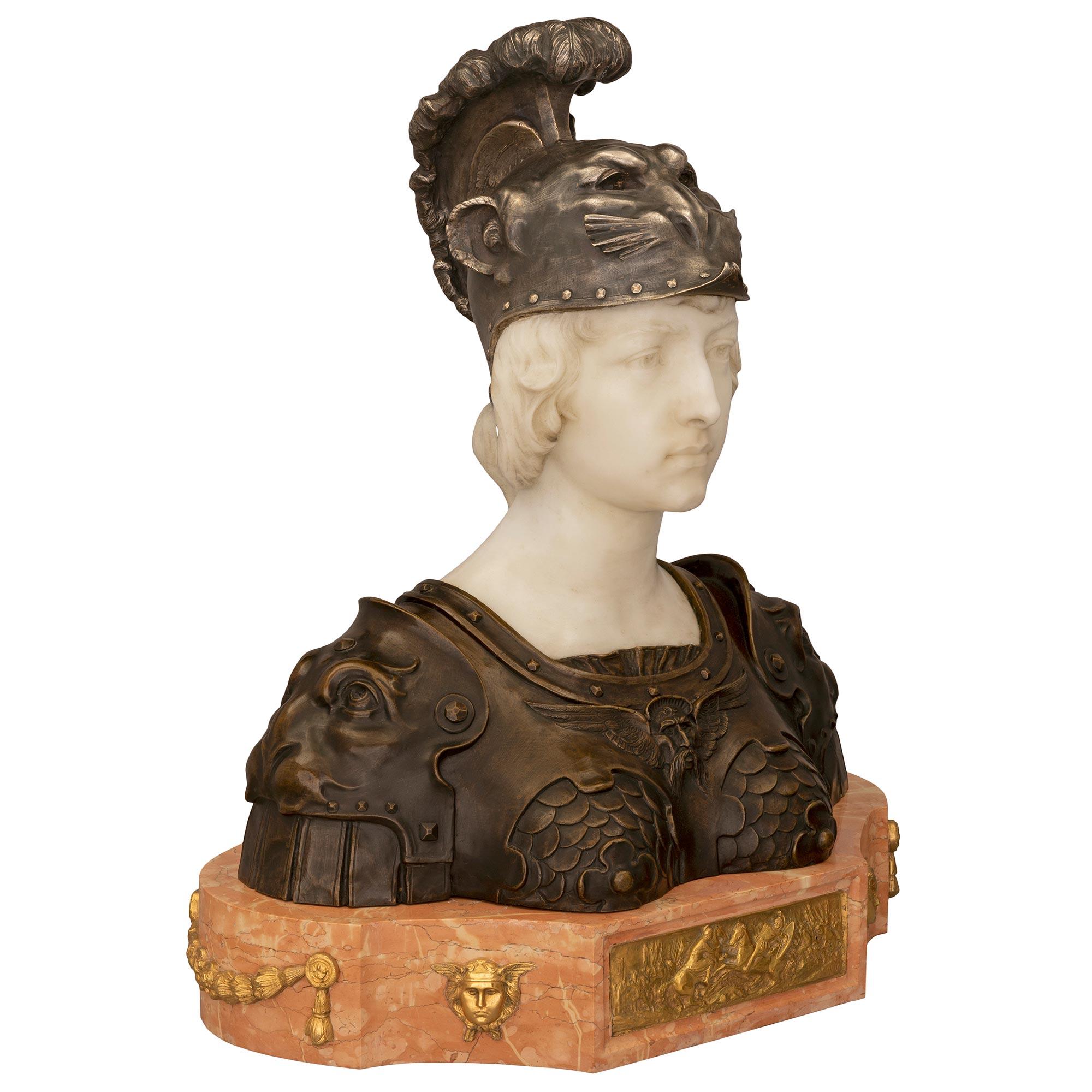 A stunning and most impressive French 19th century Neo-Classical st. patinated bronze, silvered bronze, ormolu, Rosso Verona and white Carrara marble bust of Marianne in full armor. The bust is raised by a thick Rosso Verona marble base with an