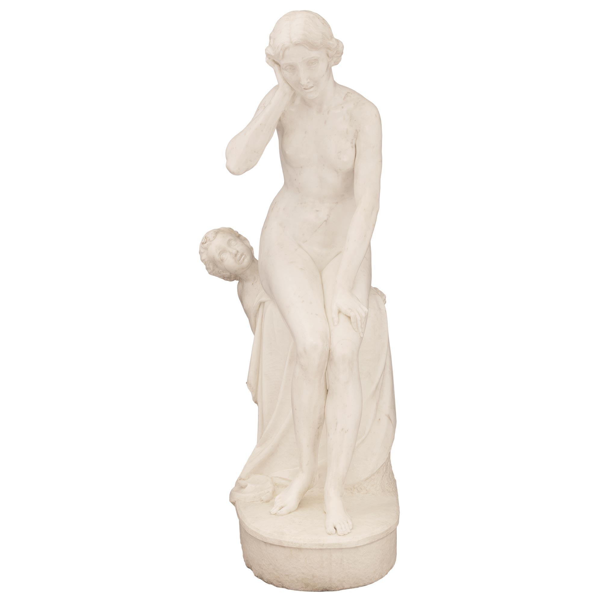 A stunning and extremely high quality French 19th century Neo-Classical st. white Carrara marble statue titled Not Wanting To Hear Love. The statue is raised by a oblong base with a fine ground design with a large rock draped in a wonderfully