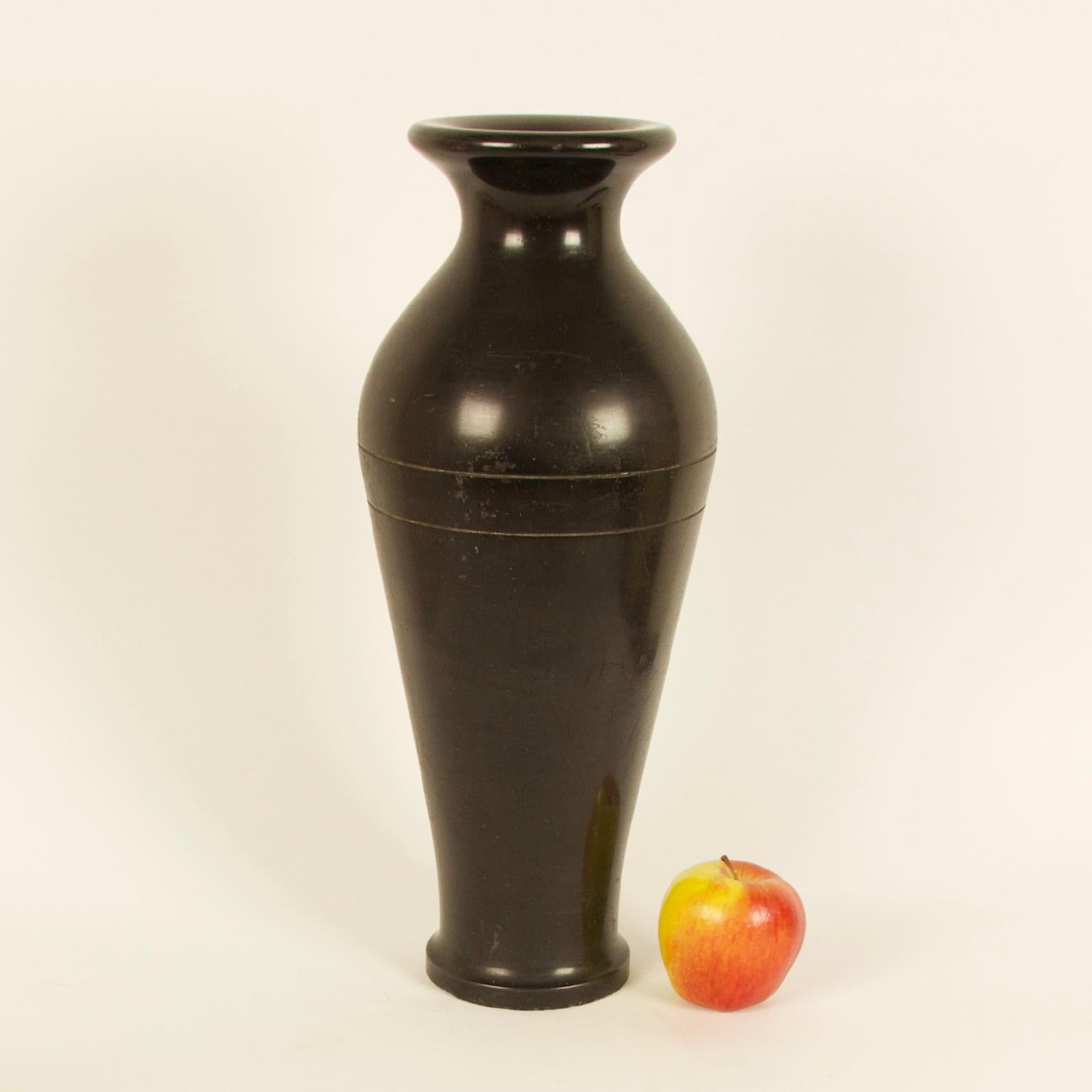 French 19th century neoclassical black marble baluster vase

Impressive neoclassical tall baluster-shaped vase made of polished black marble, showing decorative incised lines at the shoulder of the vase. 
Exceptional piece of timeless design and