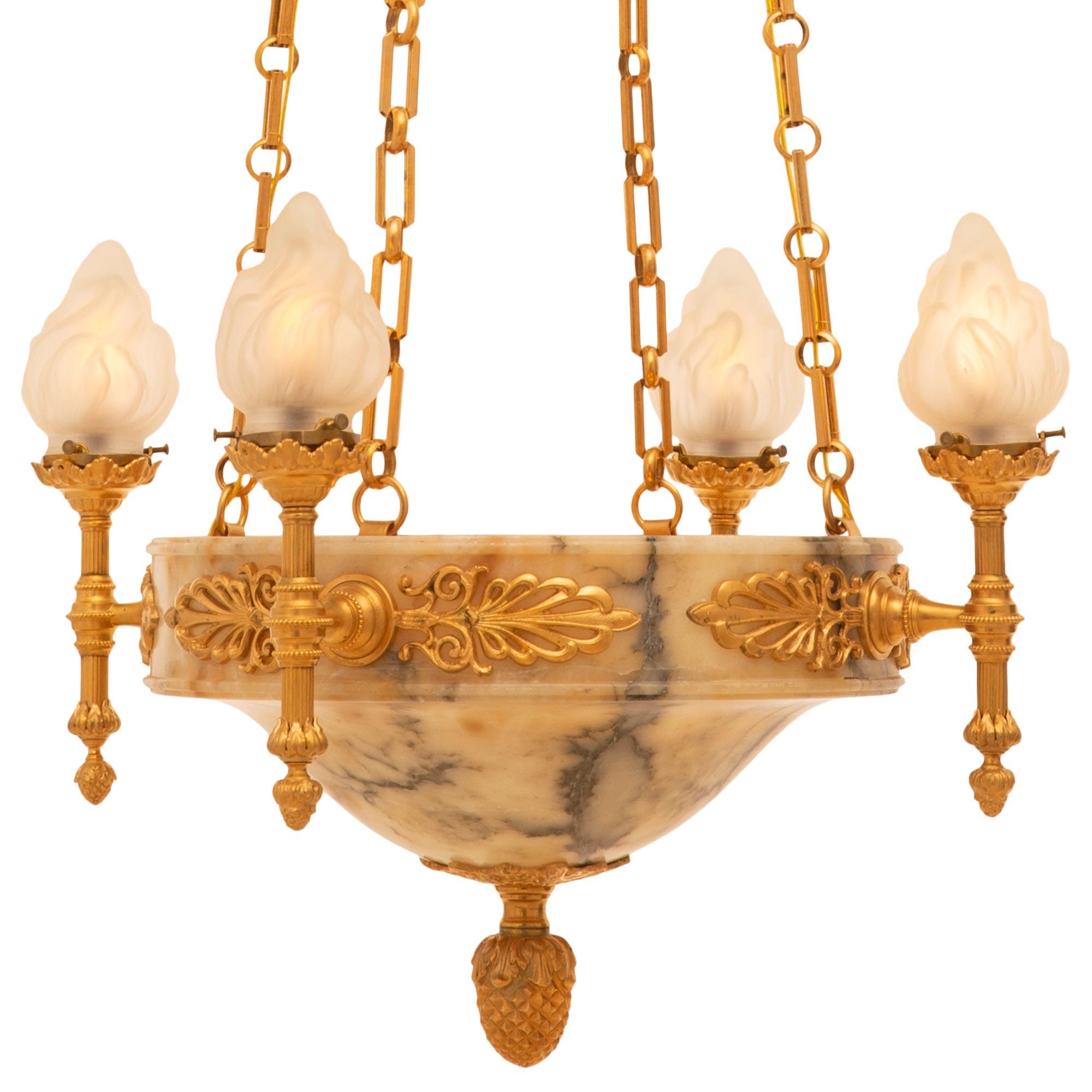 A most impressive French 19th century neo-classical st. alabaster and ormolu eight light, four arm chandelier. The chandelier is centered by an elegant ormolu acorn finial with a foliate back plate set at the striking central alabaster bowl which