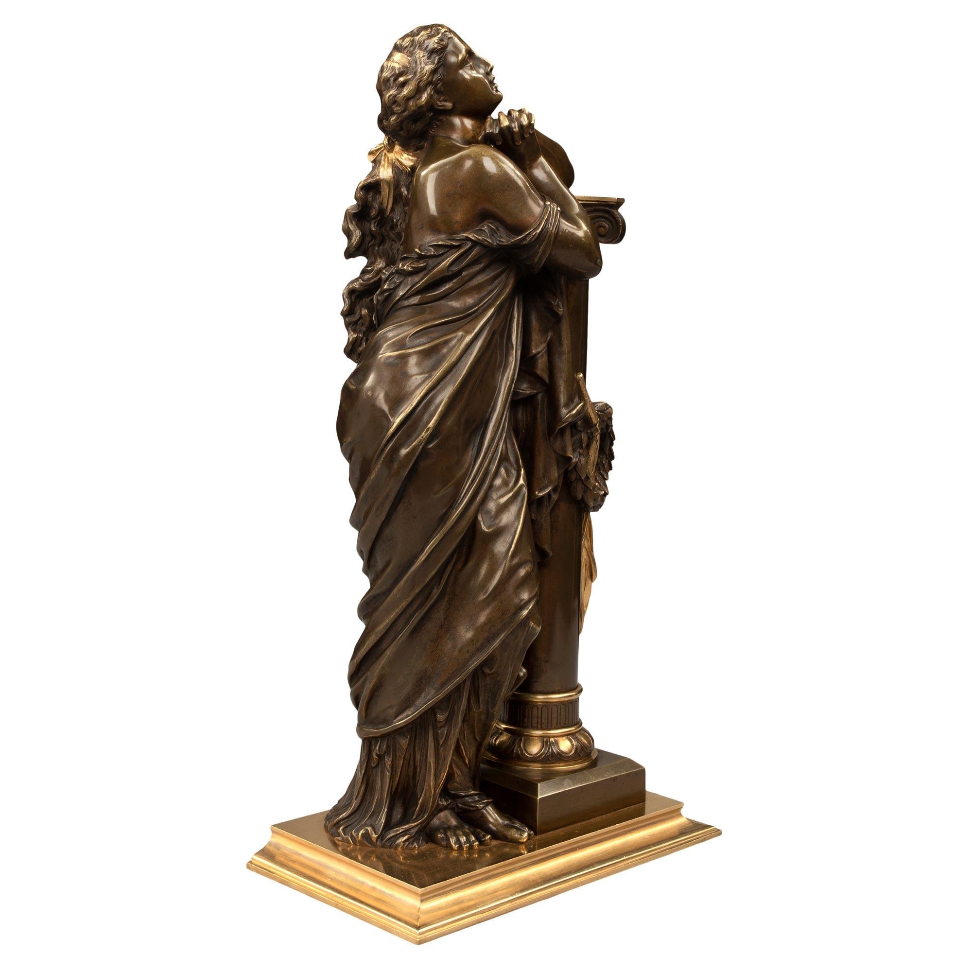 A superb and high quality French 19th century Neo-Classical st. patinated bronze and ormolu statue. The statue is raised by a rectangular ormolu base with a most elegant and decorative mottled border. Above is a beautiful maiden draped in a