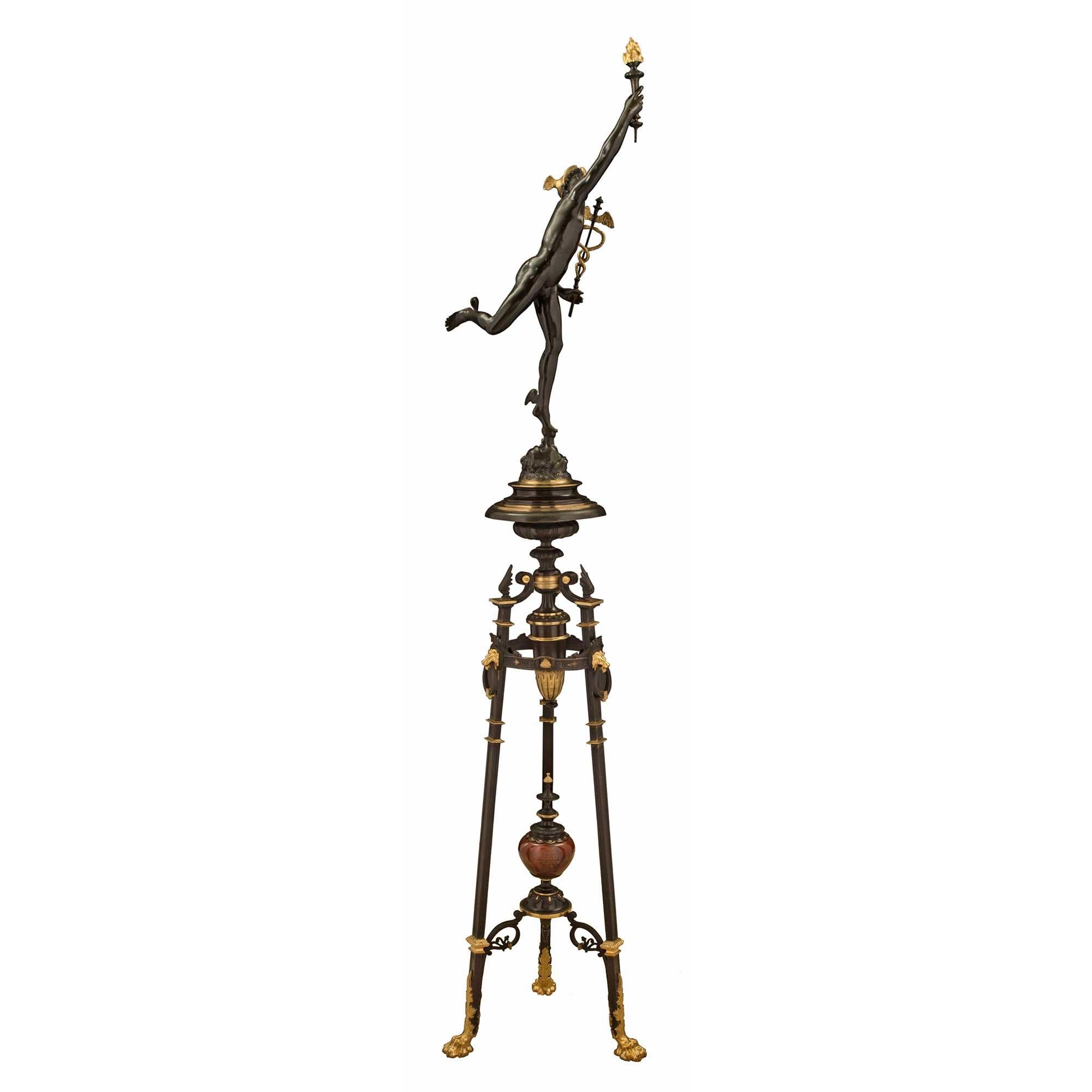 A striking French 19th century Neo-Classical st. patinated bronze and ormolu statue of Mercury, possibly by F. Barbedienne. The statue is raised on its original tripod base with handsome ormolu paw feet and large acanthus leaves. The three square