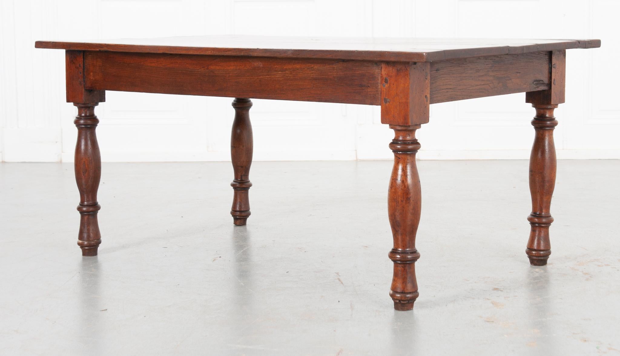 A handmade oak coffee table that is simple yet graceful. Made in the 1800’s, it’s been recently polished with a French paste wax to show off the unique grain of the wood. The modest apron is attached to beautifully turned wooden legs using treenail