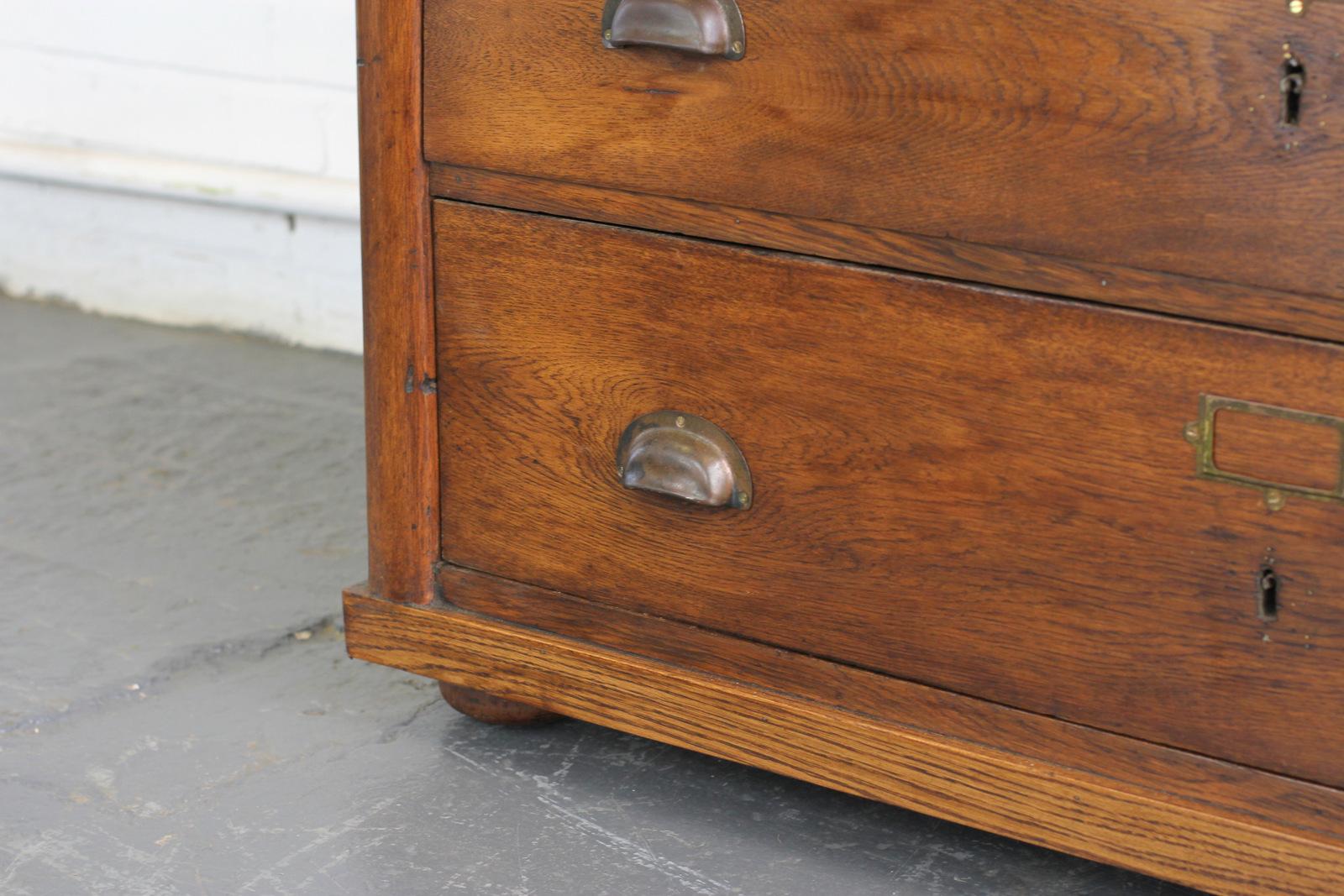 French 19th century oak drapers cabinet 

- Three gradiented drawers
- Solid oak drawers, top and sides
- Brass cup handles and card holders
- French, circa 1880s
- Measures: 122cm wide x 59cm deep x 82cm tall

Condition report

The