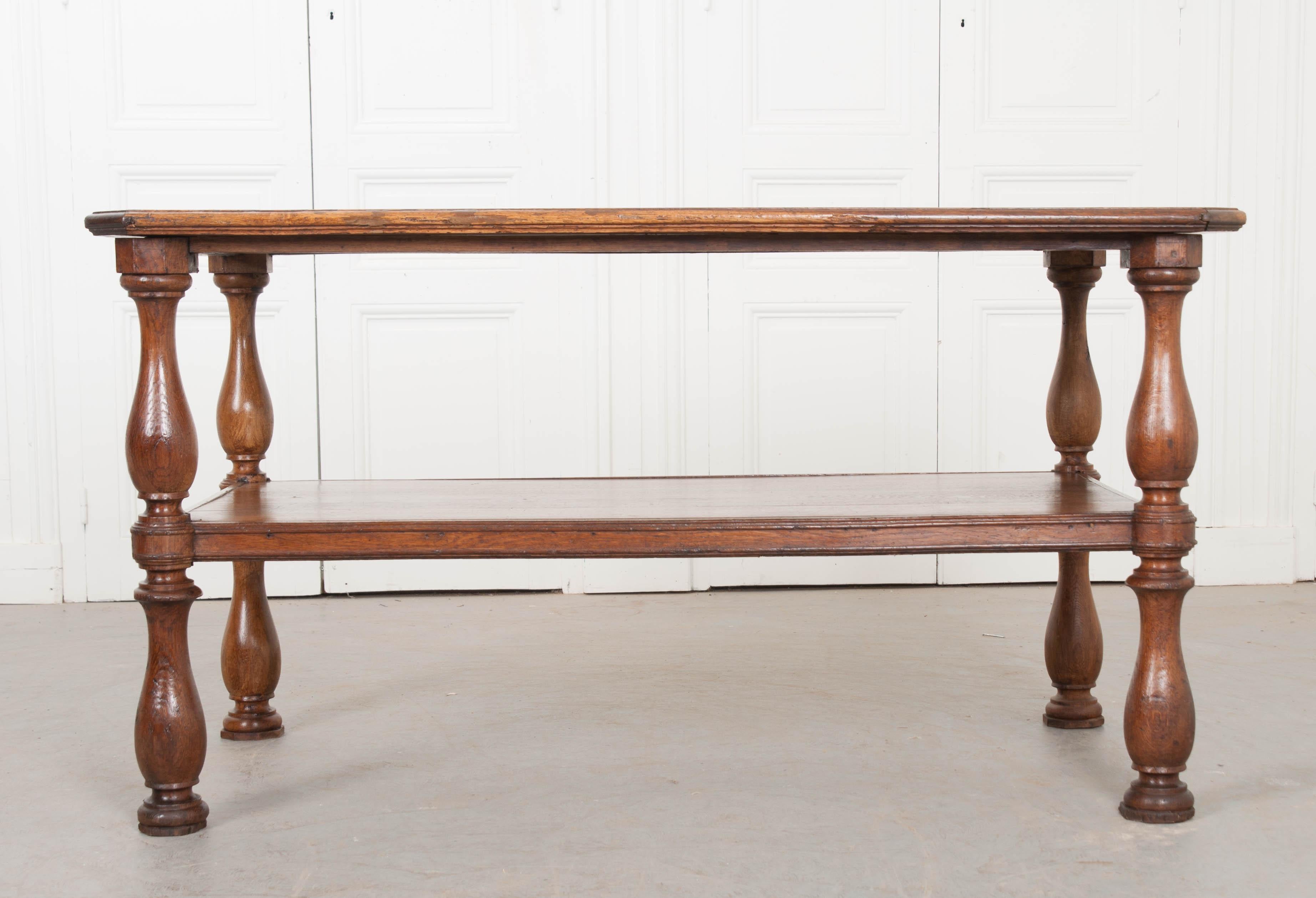 Beautiful, quarter sawn graining enrich the already lustrous oak surface of this amazing French drapers table. Originally used by tailors and seamstresses, these lengthy tables would provide a work surface long enough for yards of fabric to be laid