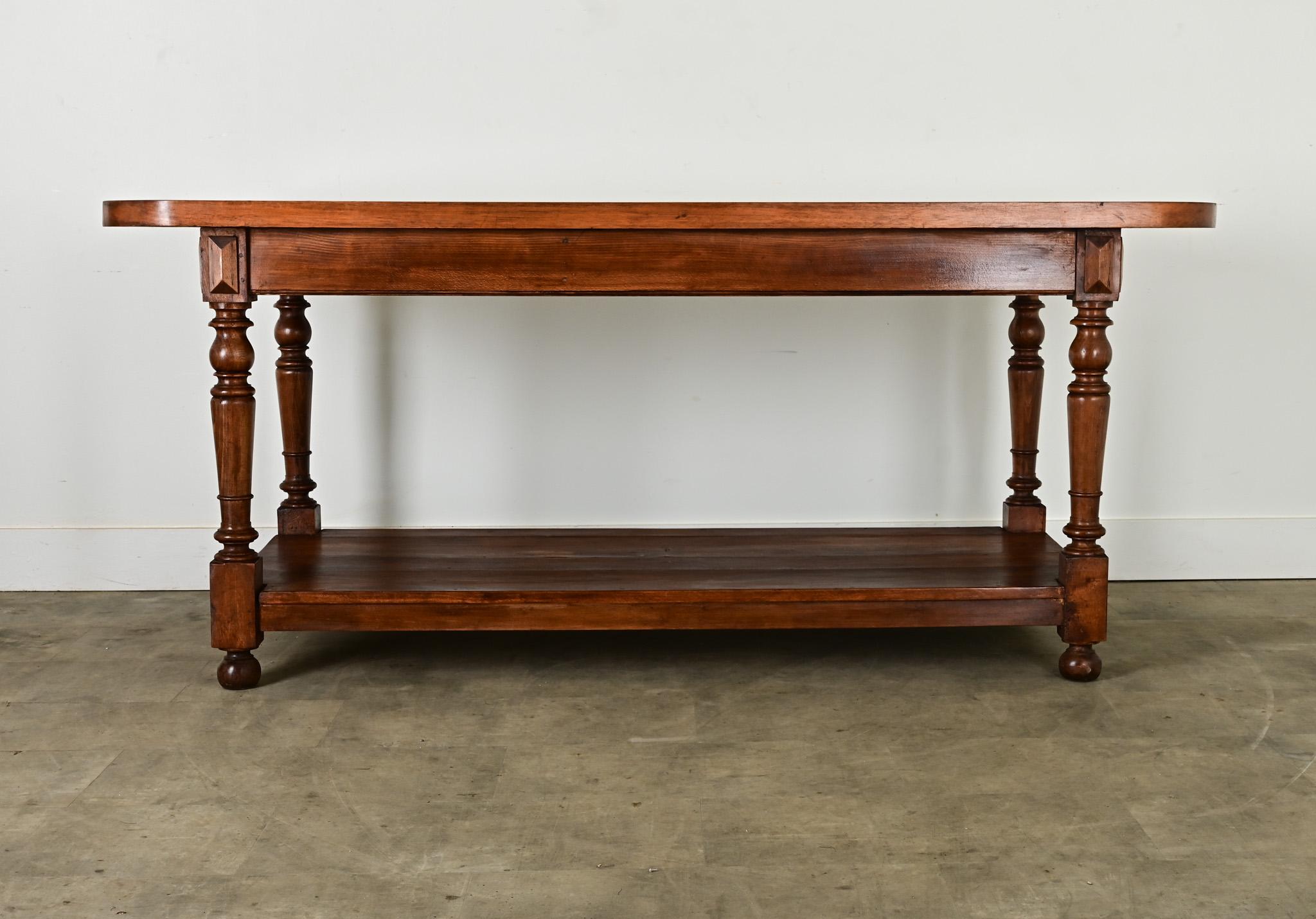 A unique drapery table from Burgundy, France, dating to the late 1800s. The tall and large surface area is ideal for any creative pursuit, artistic to culinary, which makes this example perfect as an unexpected kitchen island! The thick and