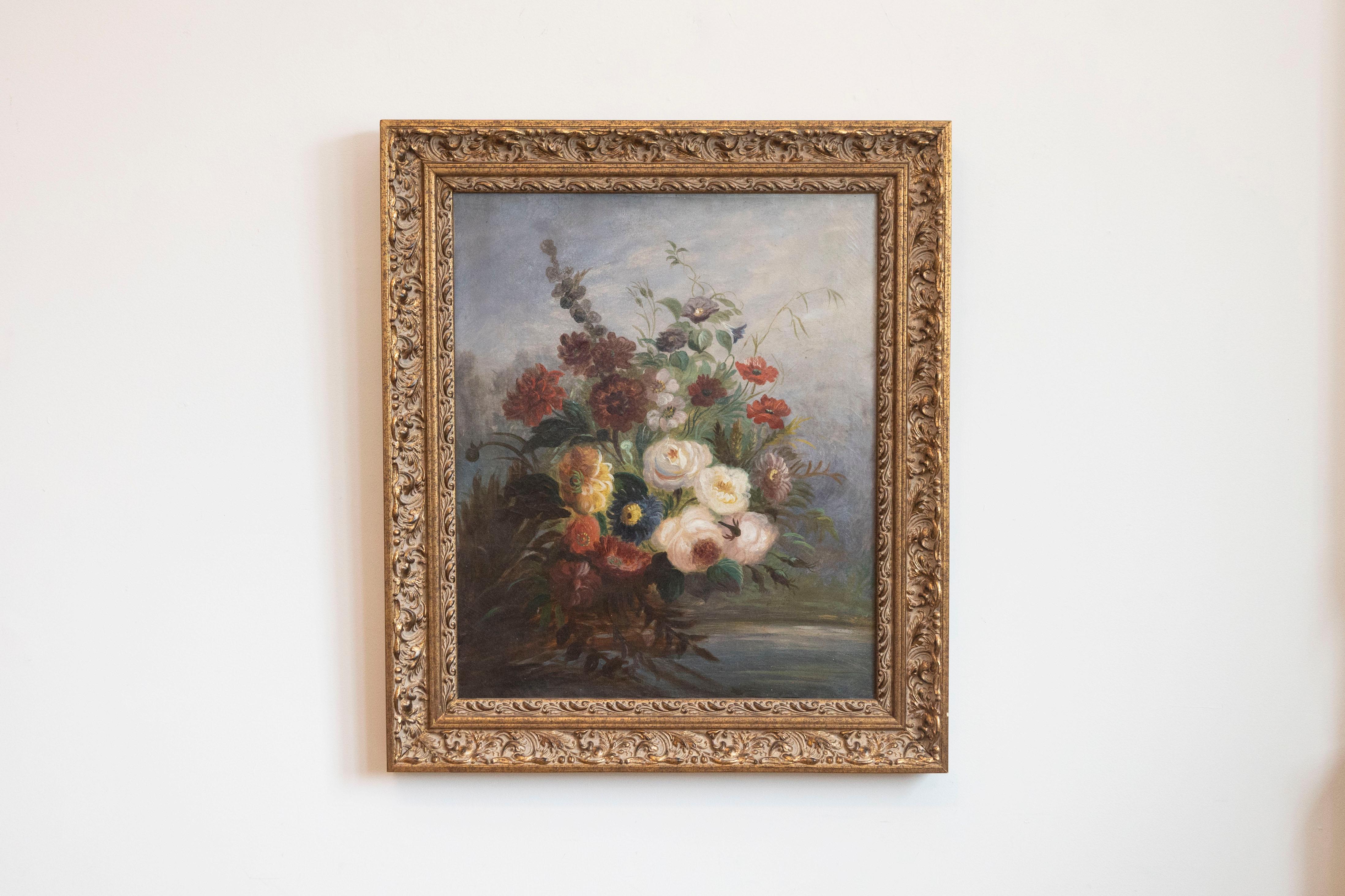 A French Restauration period oil on canvas still-life floral painting from the 19th century, in giltwood frame. Born in France during the second quarter of the 19th century, this floral painting captures our attention with its lovely colors and