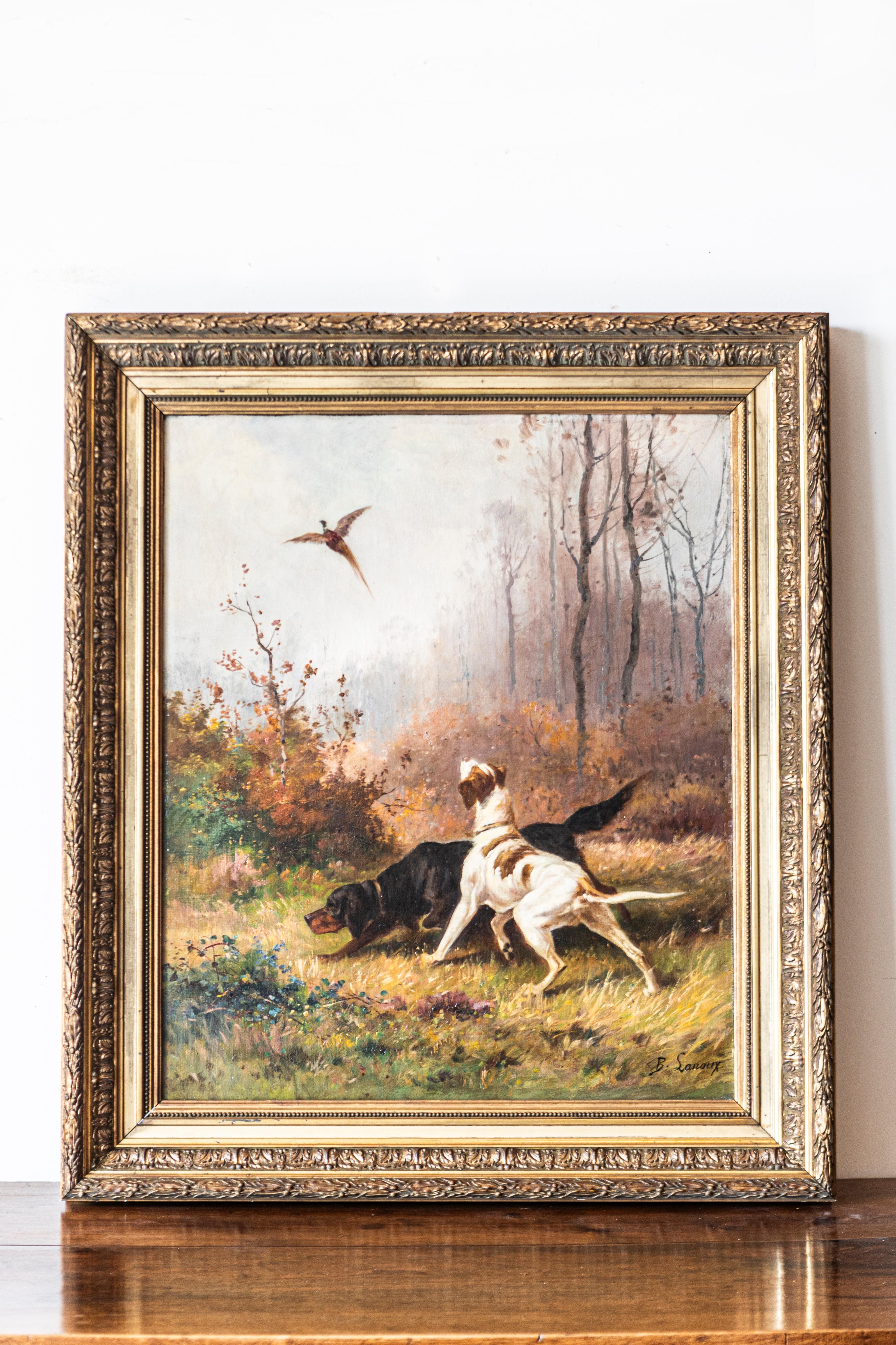 A French 19th century oil on canvas hunting scene painting signed by B. Lanoux depicting two hound dogs and a pheasant. This captivating 19th-century French oil on canvas painting by B. Lanoux, a distinguished artist whose life spanned the 19th and