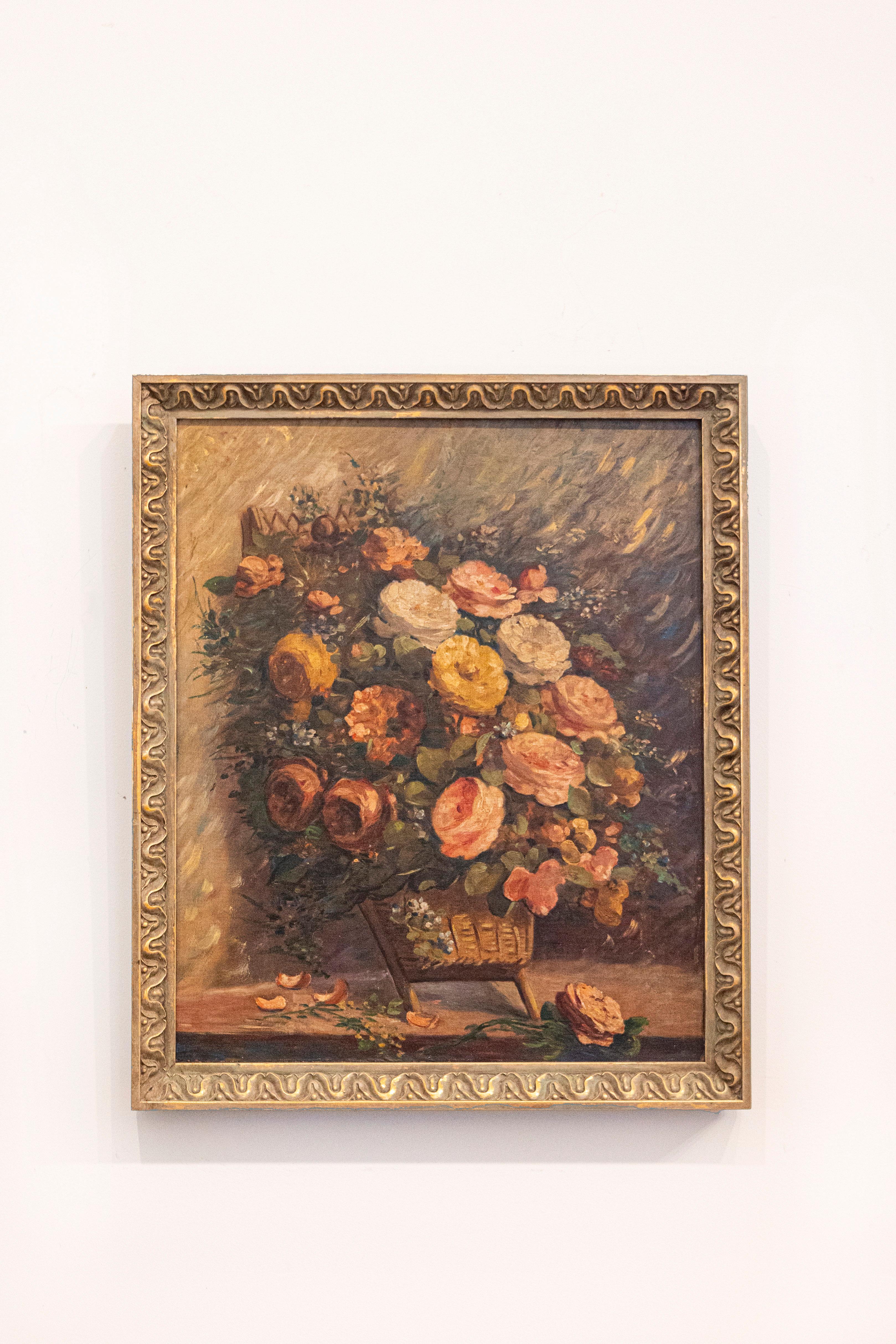 A French framed oil on canvas still-life painting from the 19th century, depicting roses in a basket. Born in France during the 19th century, this elegant oil on canvas depicts a luscious bouquet of pink, white and yellow roses overflowing a small