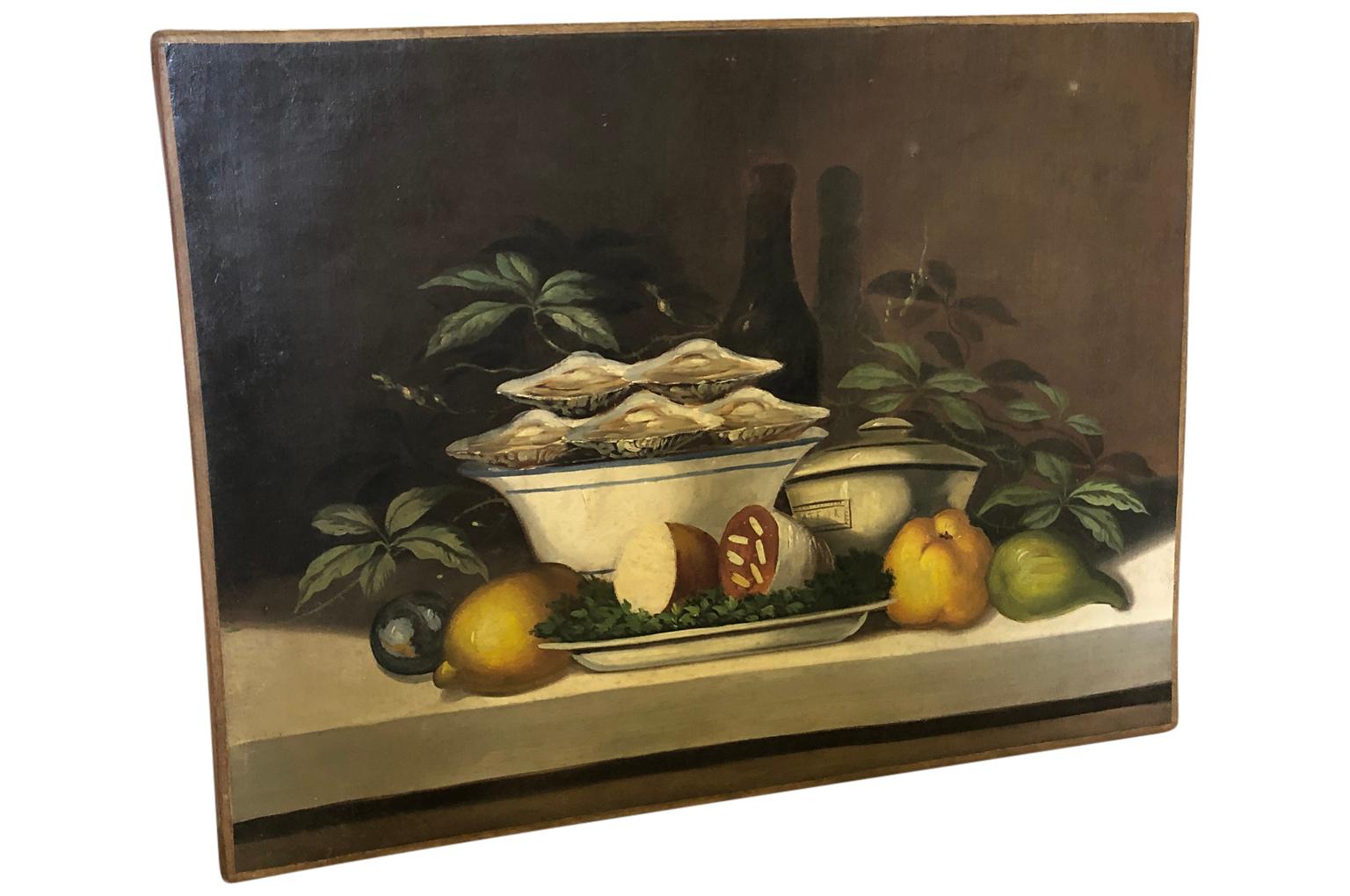 A delightful French 19th century oil painting from the South of France. A delicious subject mater - Huitres - Oysters on the half shell, saucisson sec, wine and more. A perfect picnic.