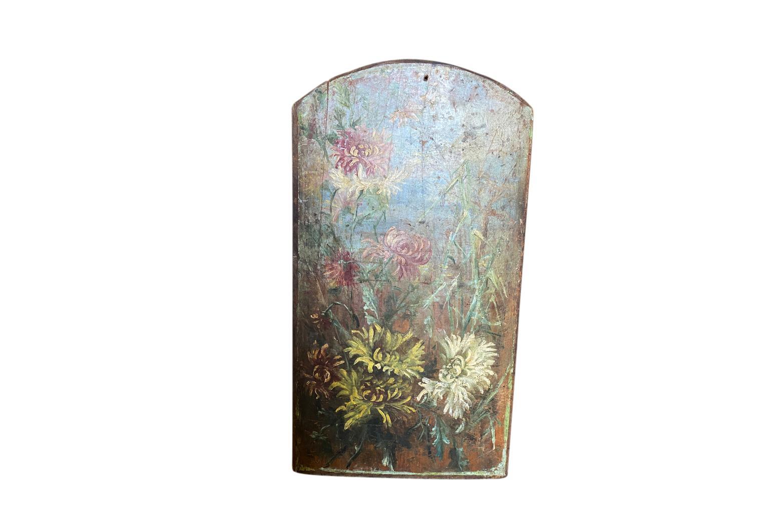 A very charming and primitive oil on board floral painting from the South of France. Lovely brushwork and texture.