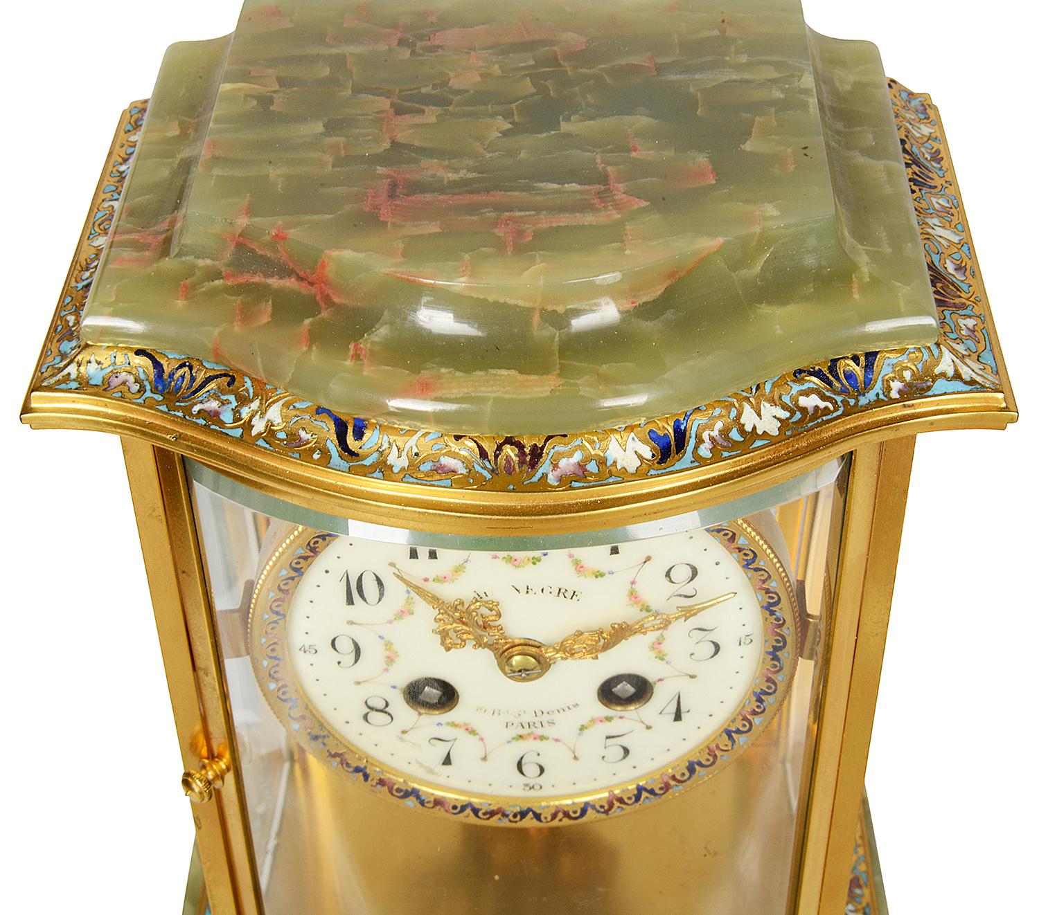 A very good quality late 19th century French gilded ormolu, champleve enamel and onyx four glass mantel clock. The white enamel clock face with floral painted swags, the clock strikes on the hour, half hour and has an eight day duration.
Paris maker.