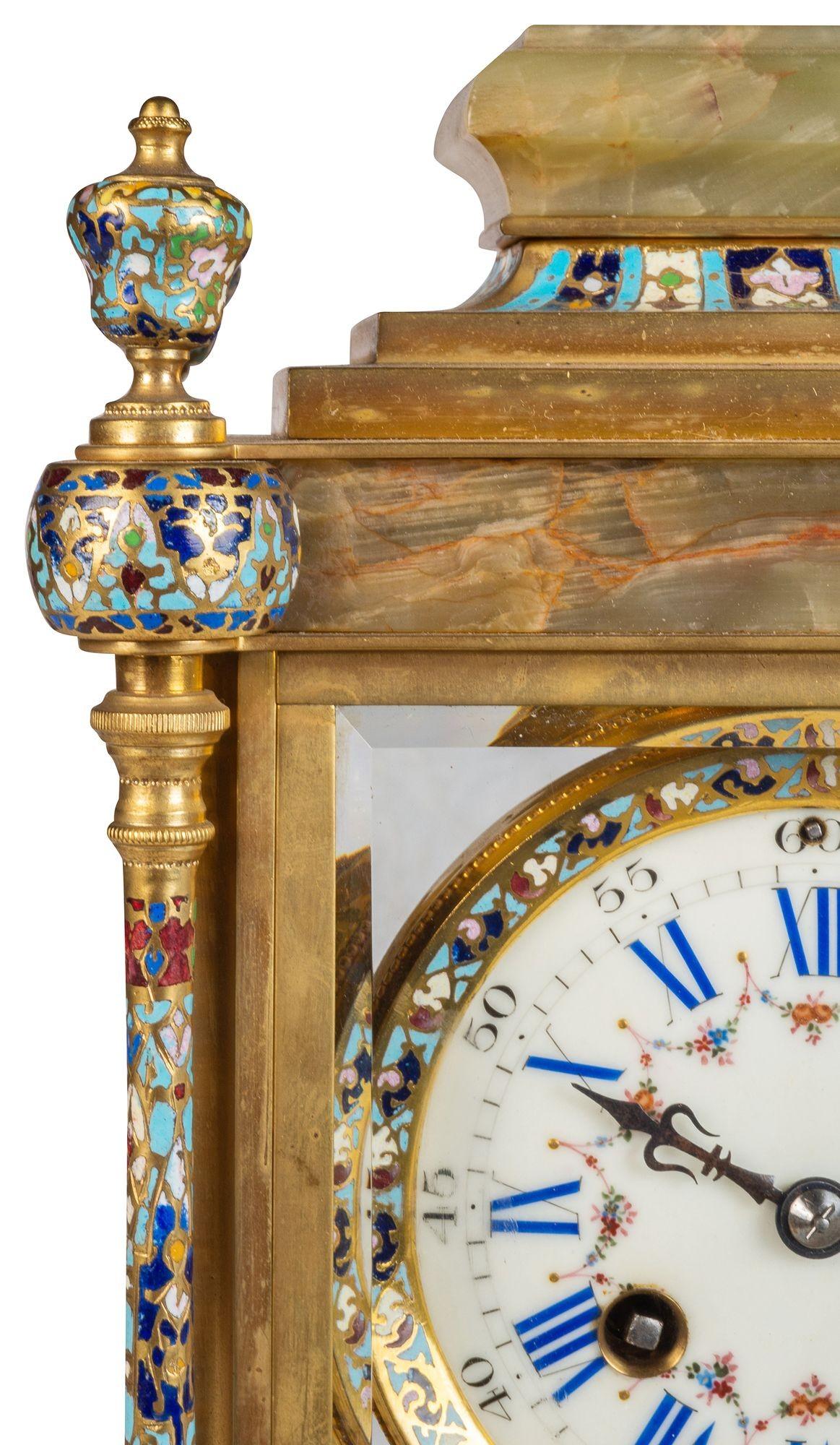 A good quality late 19th Century French Onyx, gilded ormolu and champleve enamel four glass mantel clock, having a white enamel clock face, roman numerals, an eight day duration movement, striking on the hour and half hour.

Batch 74 N/H