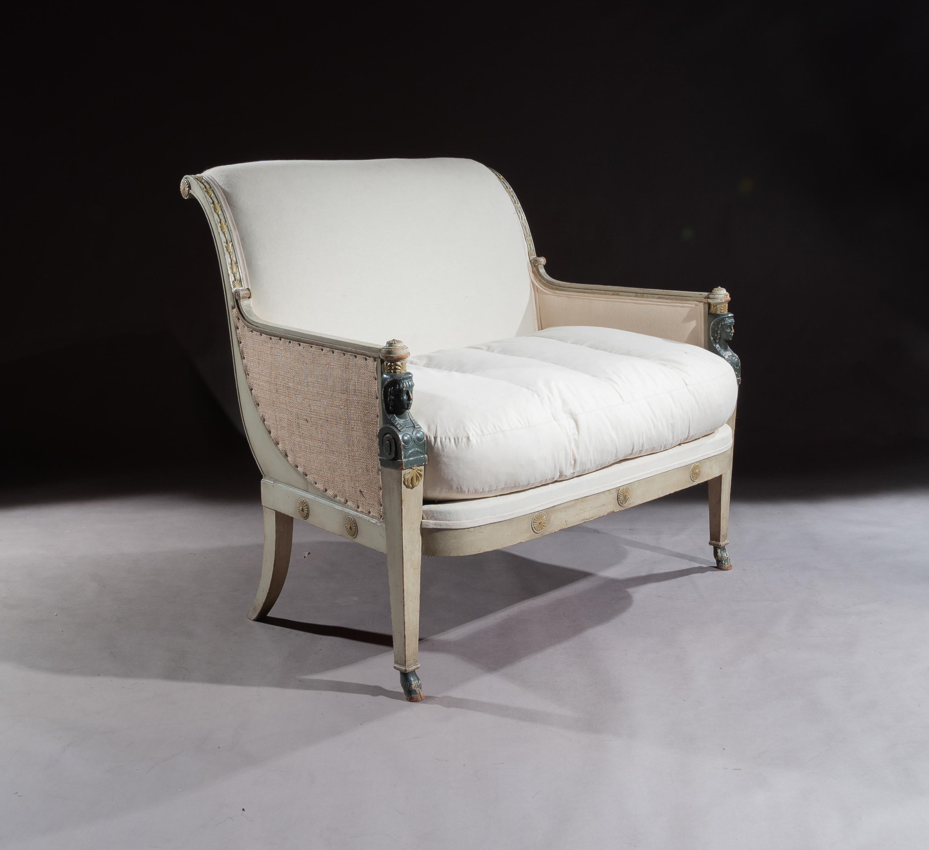 A very elegant and wonderfully drawn French 19th century Second Empire marquise loveseat / small sofa retaining the original paintwork.

French, circa 1870.

Extremely well drawn, having a very chic profile, the shaped softly upholstered back