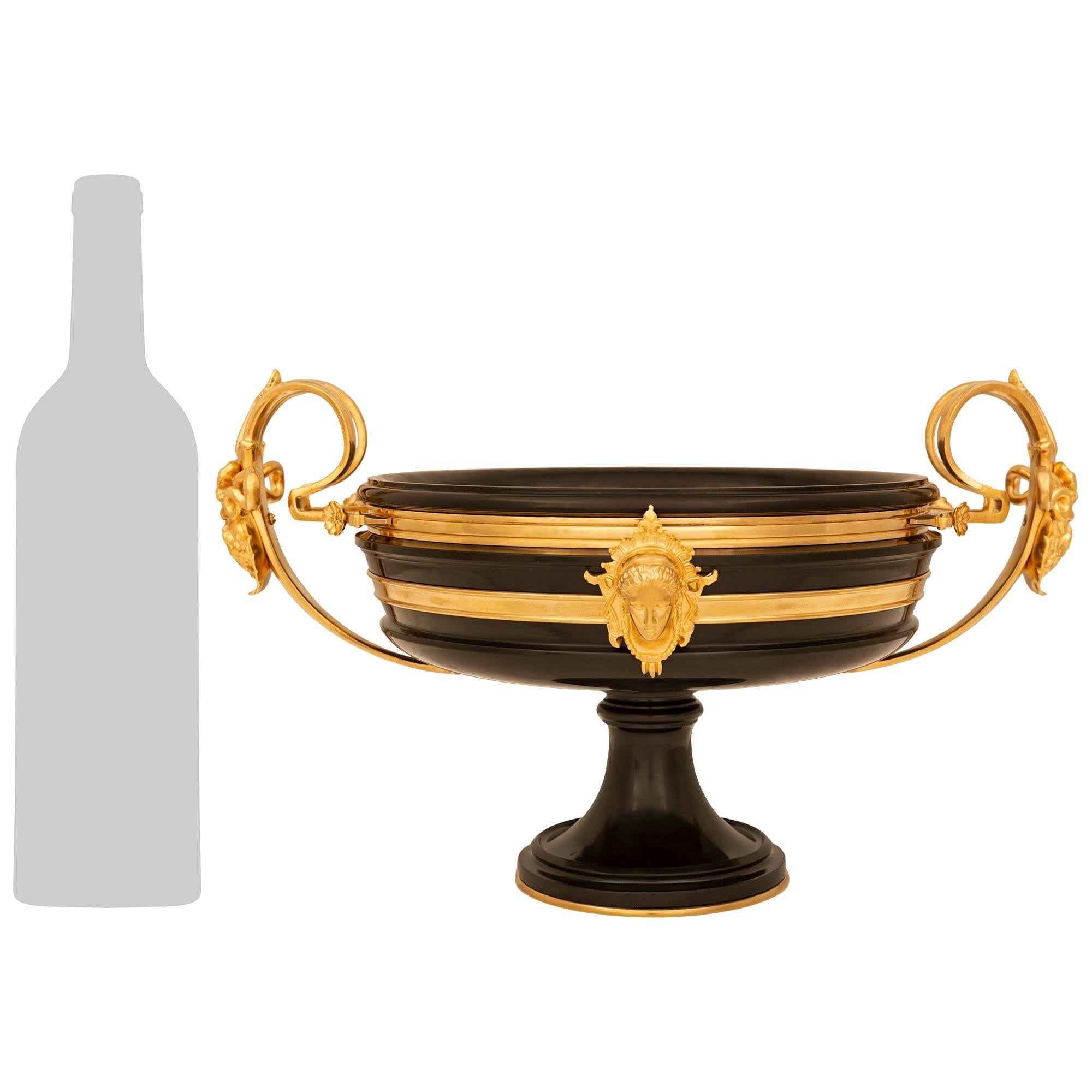 A handsome and high quality French 19th century Louis XVI st. Ormolu and black Belgian marble centerpiece, signed F. Barbedienne. This stunning centerpiece/tazza is raised on a circular Ormolu base plate below the black Belgian marble socle support