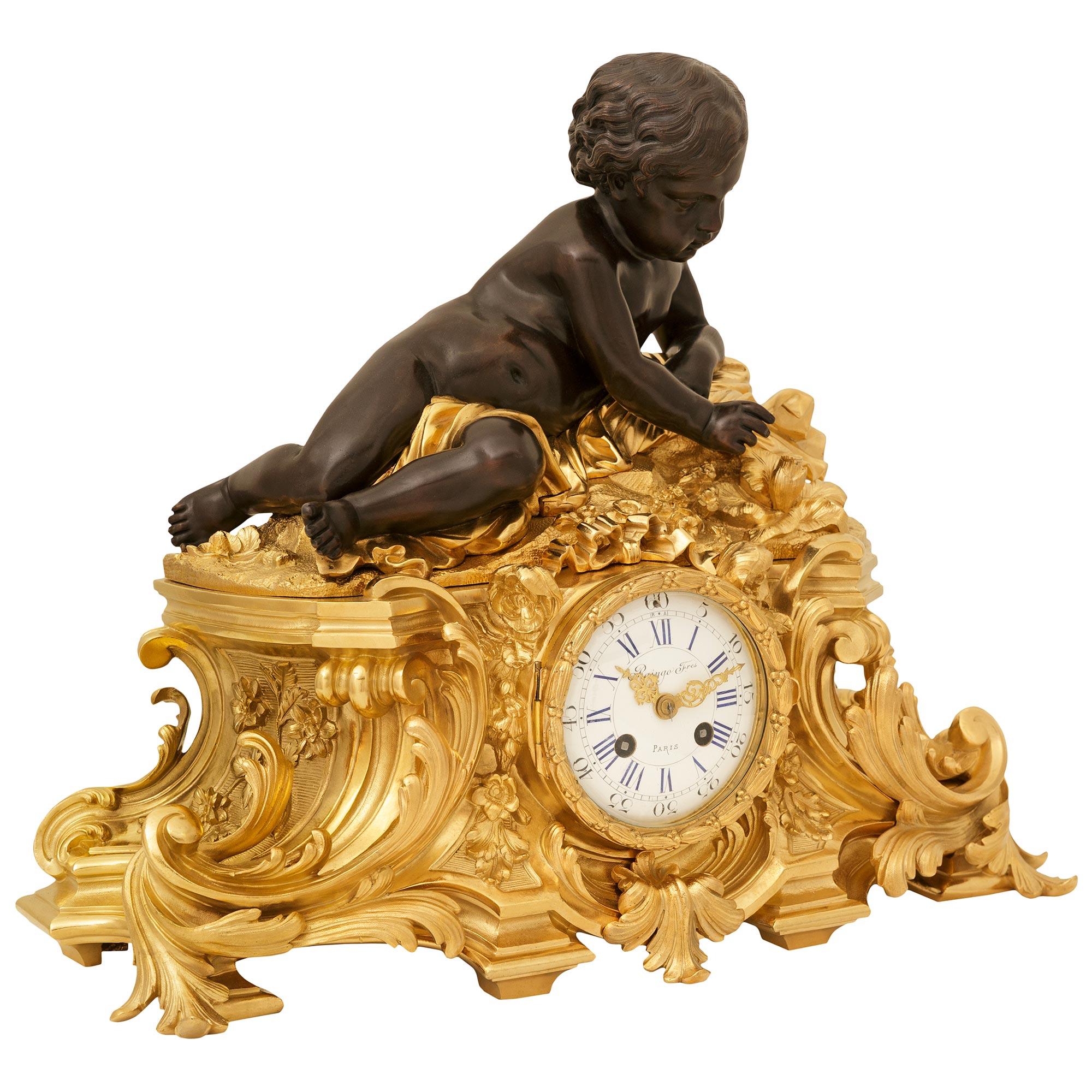 Louis XV French 19th century Ormolu and Bronze clock, signed Raingo Freres For Sale