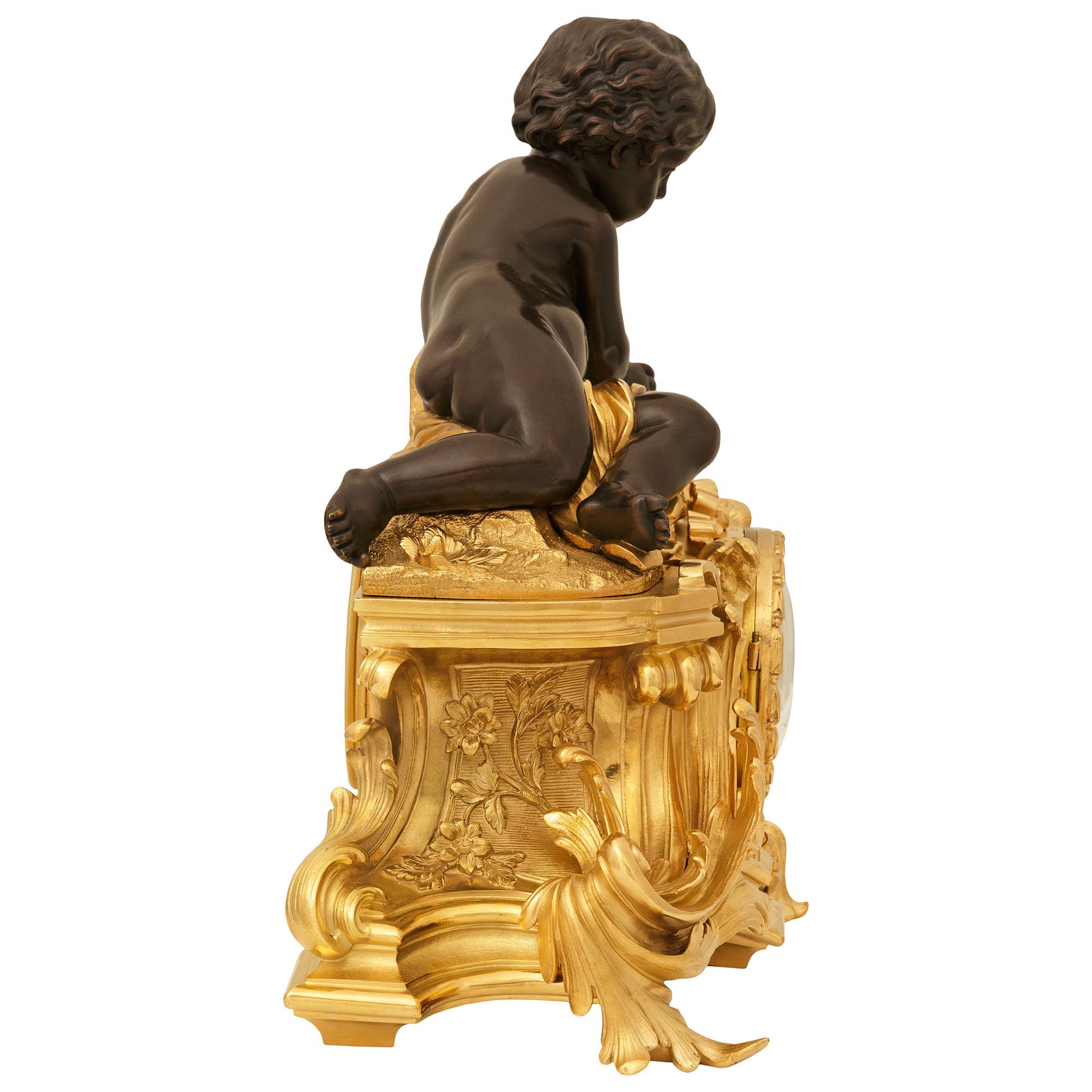 French 19th century Ormolu and Bronze clock, signed Raingo Freres In Good Condition For Sale In West Palm Beach, FL