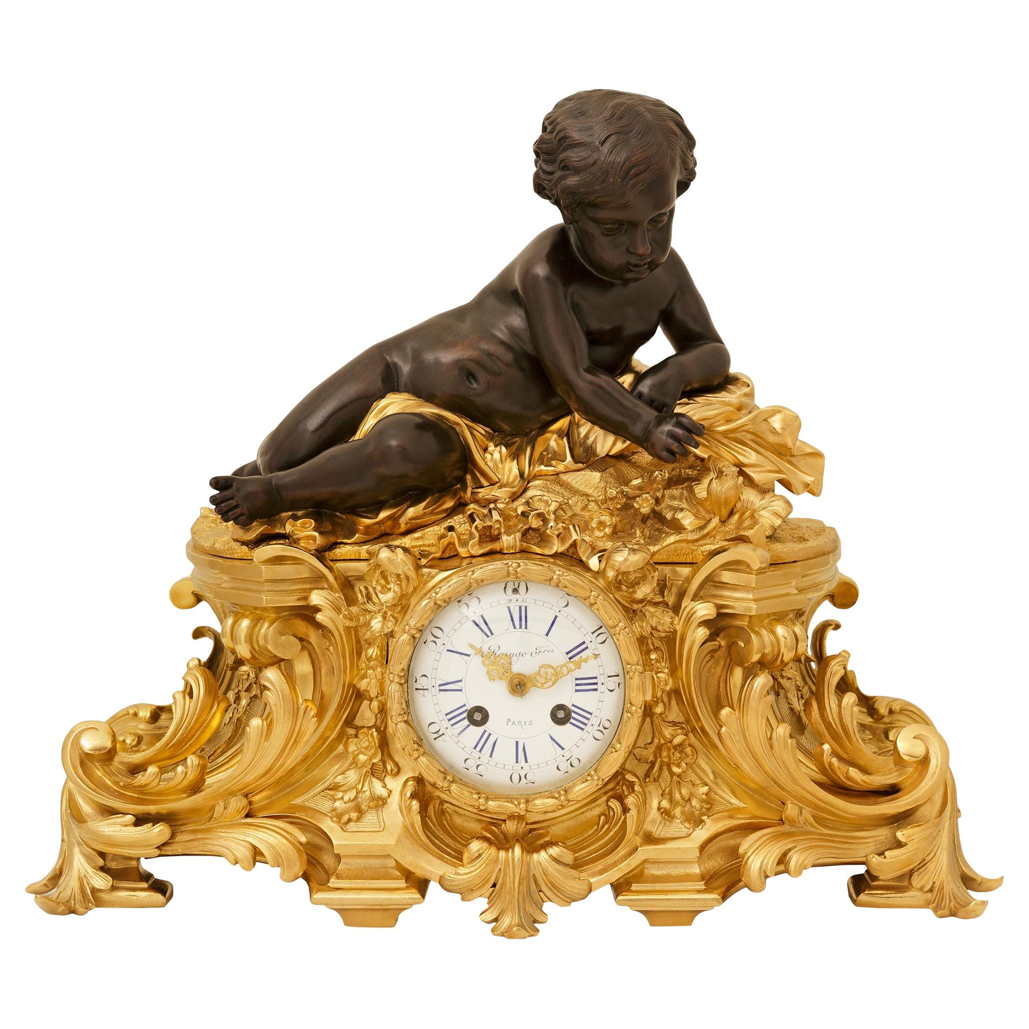 French 19th century Ormolu and Bronze clock, signed Raingo Freres For Sale