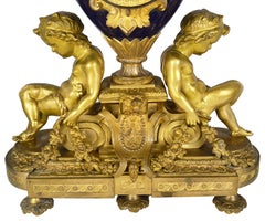 French 19th Century Ormolu and Porcelain Clock Set