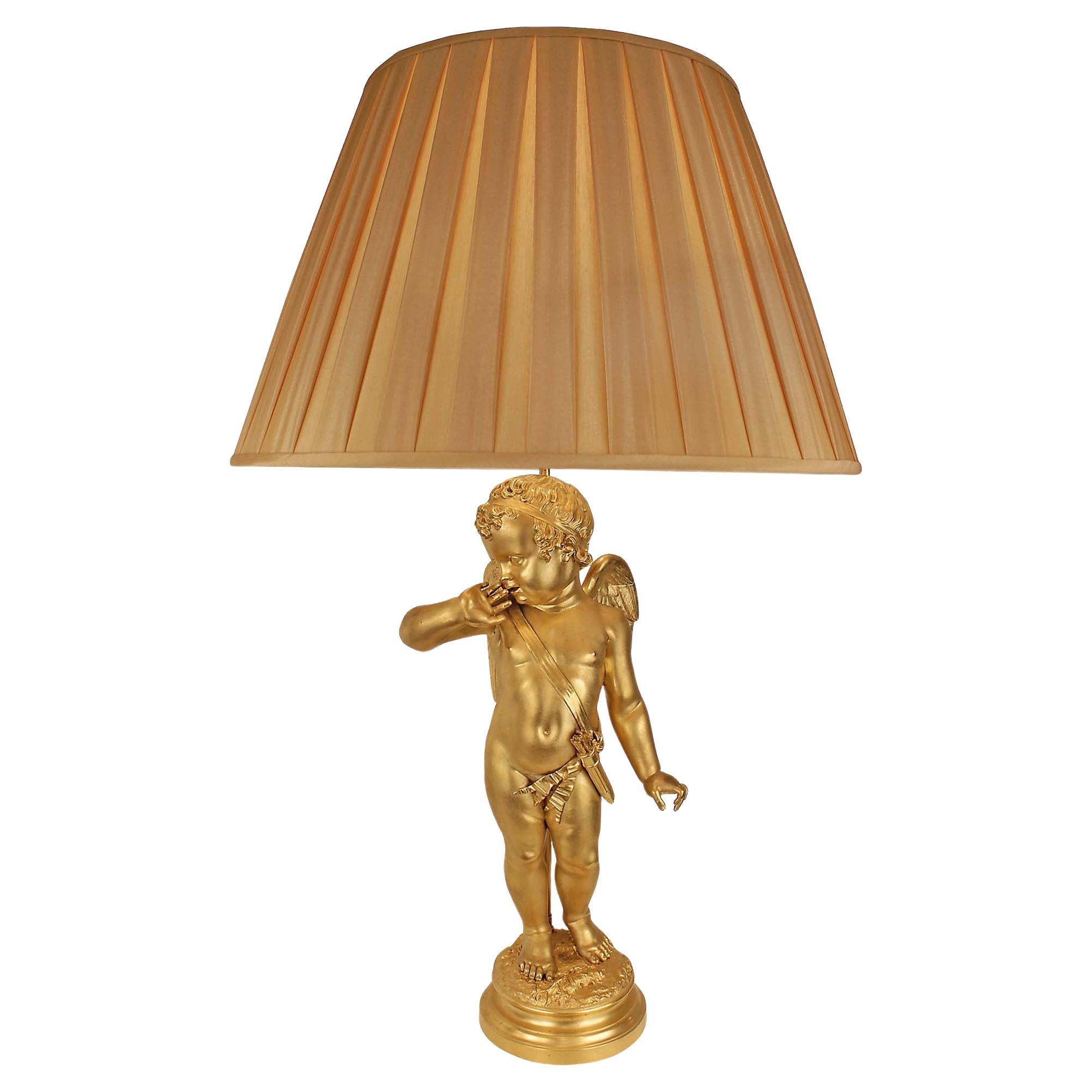 Lampe chérubin en bronze doré du XIXe siècle, d'après une sculpture de Pigalle en vente