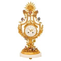 French 19th century Ormolu, Marble and Porcelain clock, by F. Pelissier