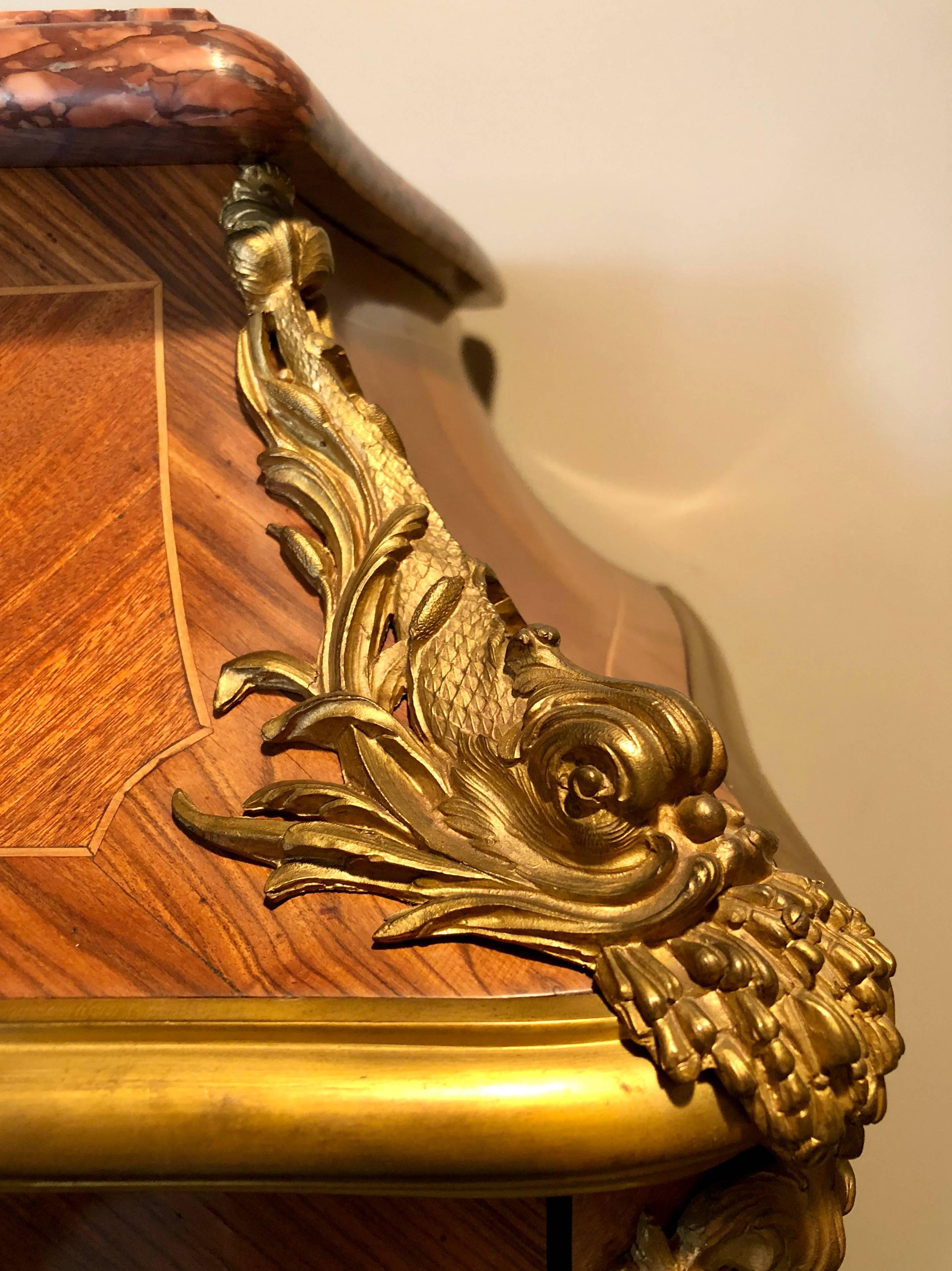 A very fine French ormolu-mounted kingwood, bois satine and tulipwood bibliotheque, early Louis XV style, by Francois Linke.
Signed: F. Linke
Having the original marble of Aleppo Breccia in France, and the center with beautiful gilt bronze