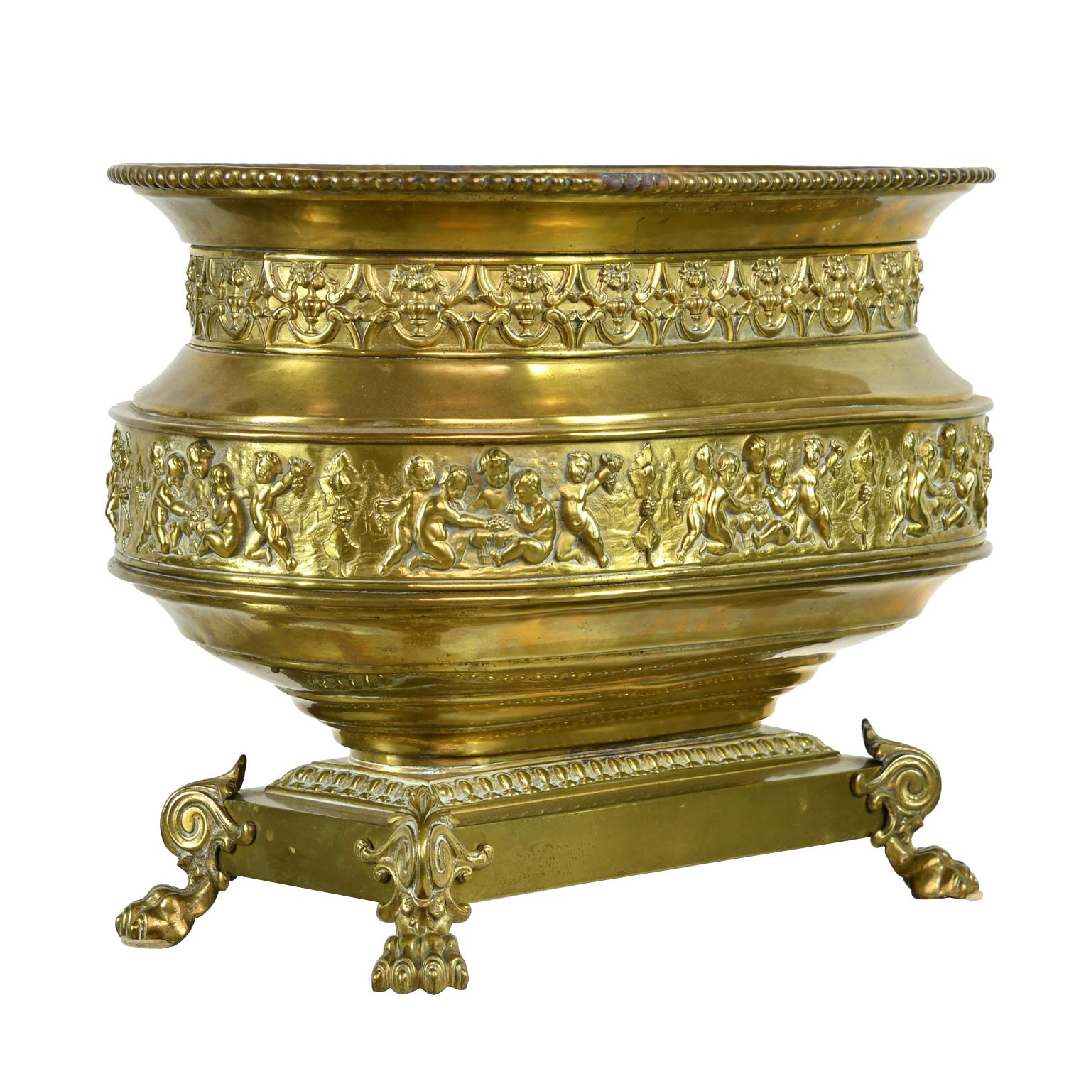 Belle Époque French 19th Century Oval Brass Wine Cooler or Cache Pot with Repoussé of Cherubs