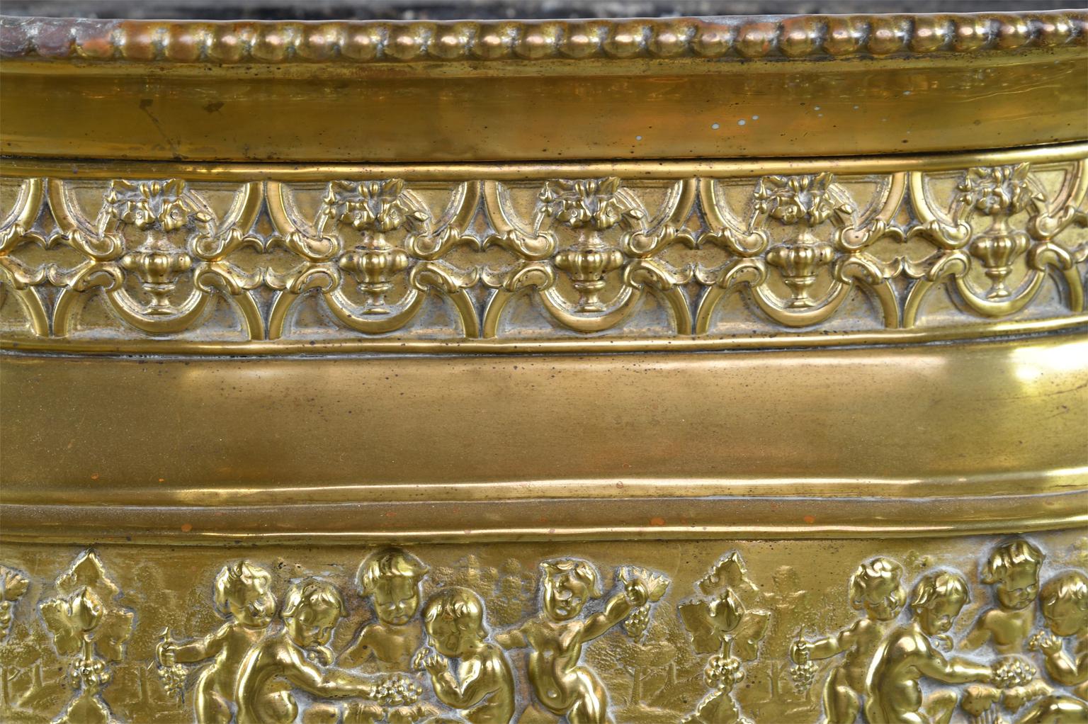 French 19th Century Oval Brass Wine Cooler or Cache Pot with Repoussé of Cherubs 3