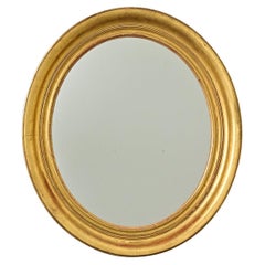 French 19th Century Oval Gilt Mirror French 19th Century Oval Gilt Mirror