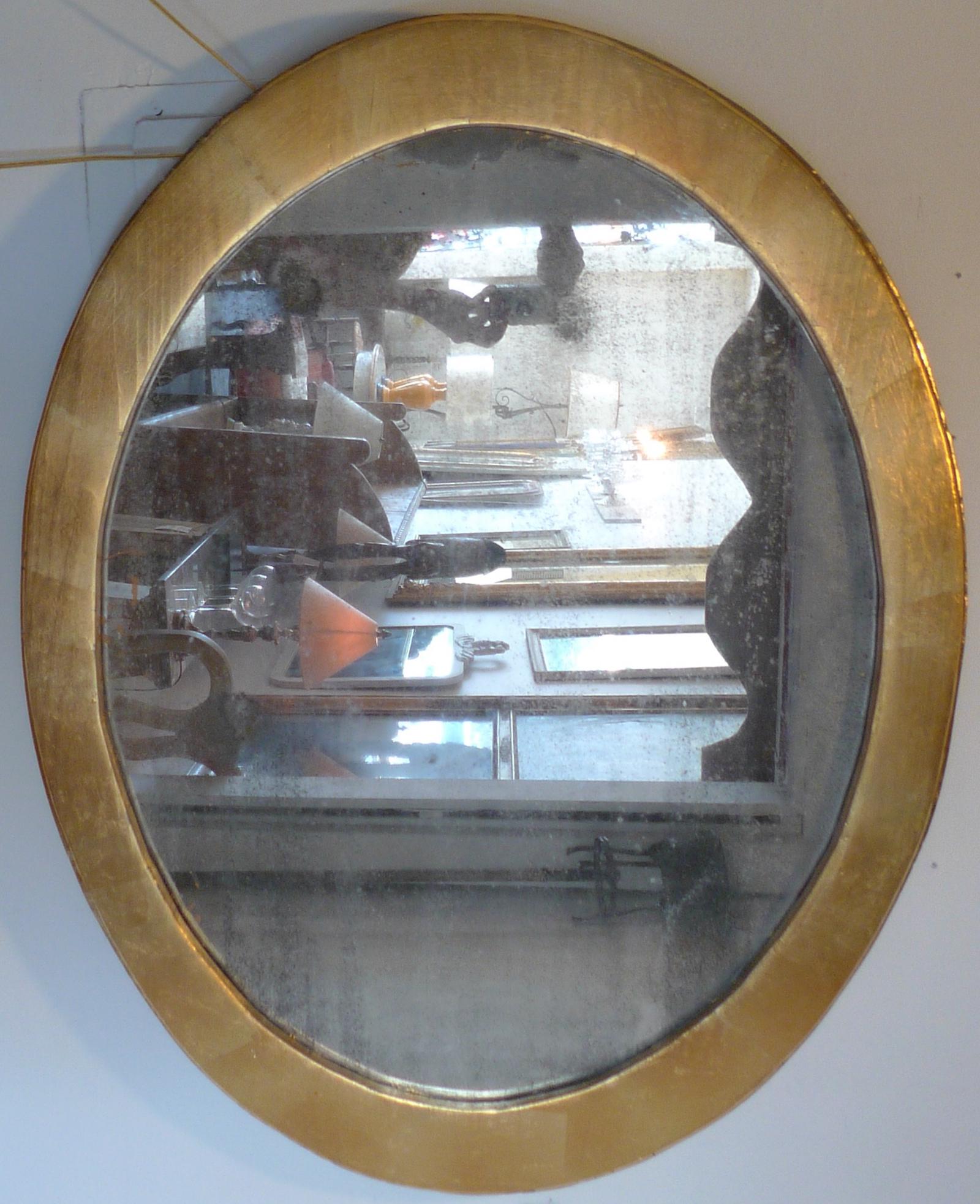 French 19th century oval gold painted oval wood framed mirror and original glass.
   