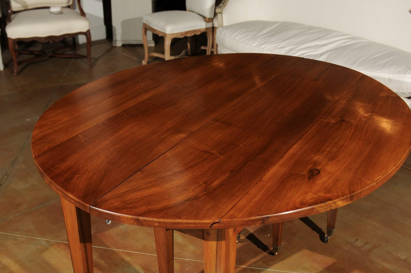 French 19th Century Oval Walnut Extension Dining Room Table with Brass Casters 6