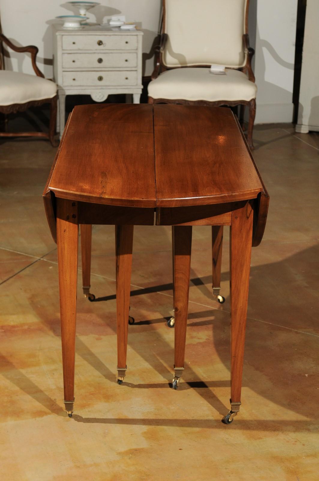 French 19th Century Oval Walnut Extension Dining Room Table with Brass Casters 7